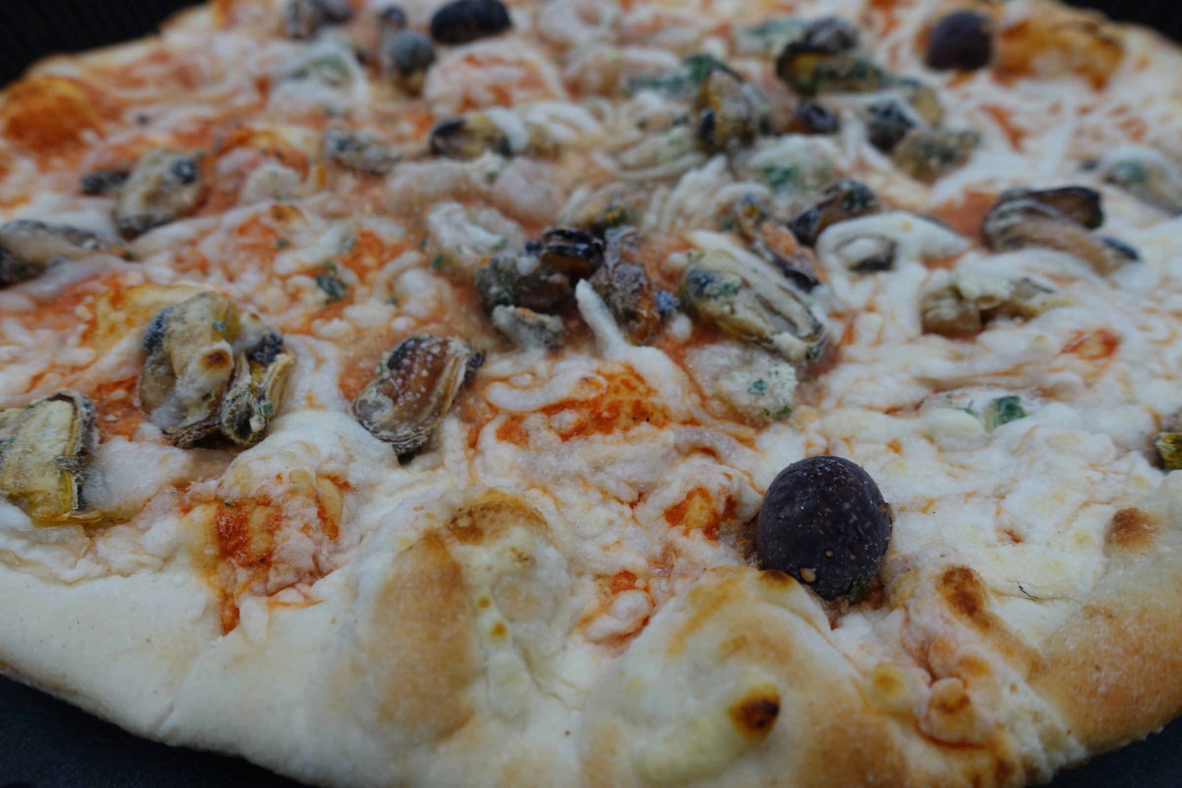 Seafood pizza   Frozen food to be cooked in the oven