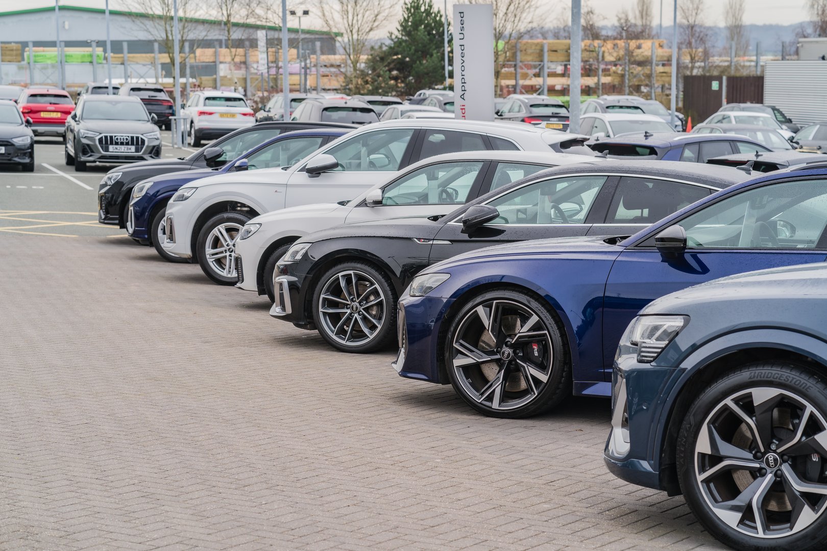 Row of cars at a dealership lot