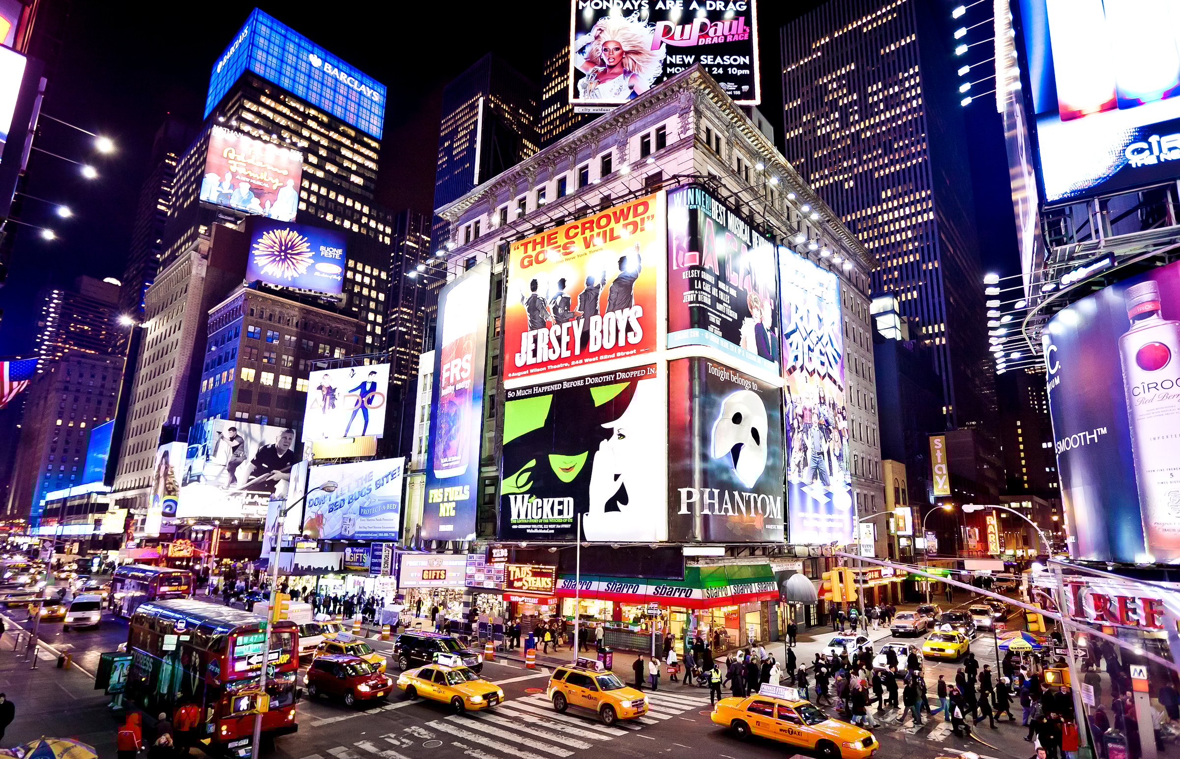 "New York, USA - January 7, 2011: Illuminated facades of Broadway theaters in Times Square is a symbol of New York City and the United States"