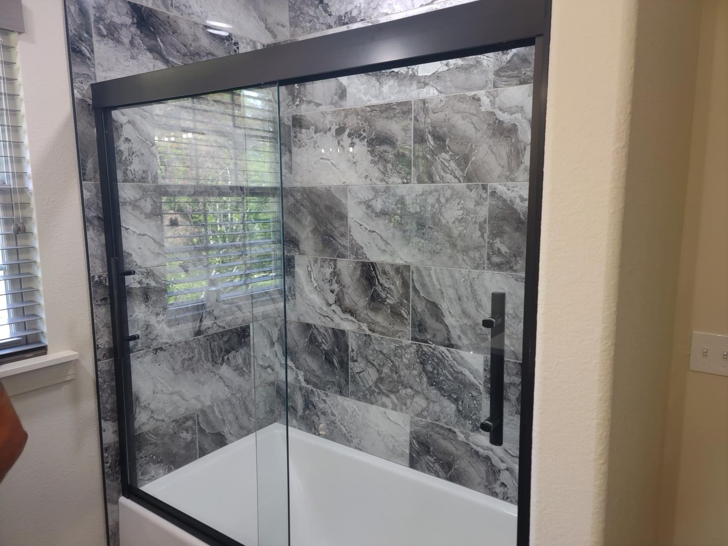 Matte black sliding shower door - custom residential glass Southwest Missouri