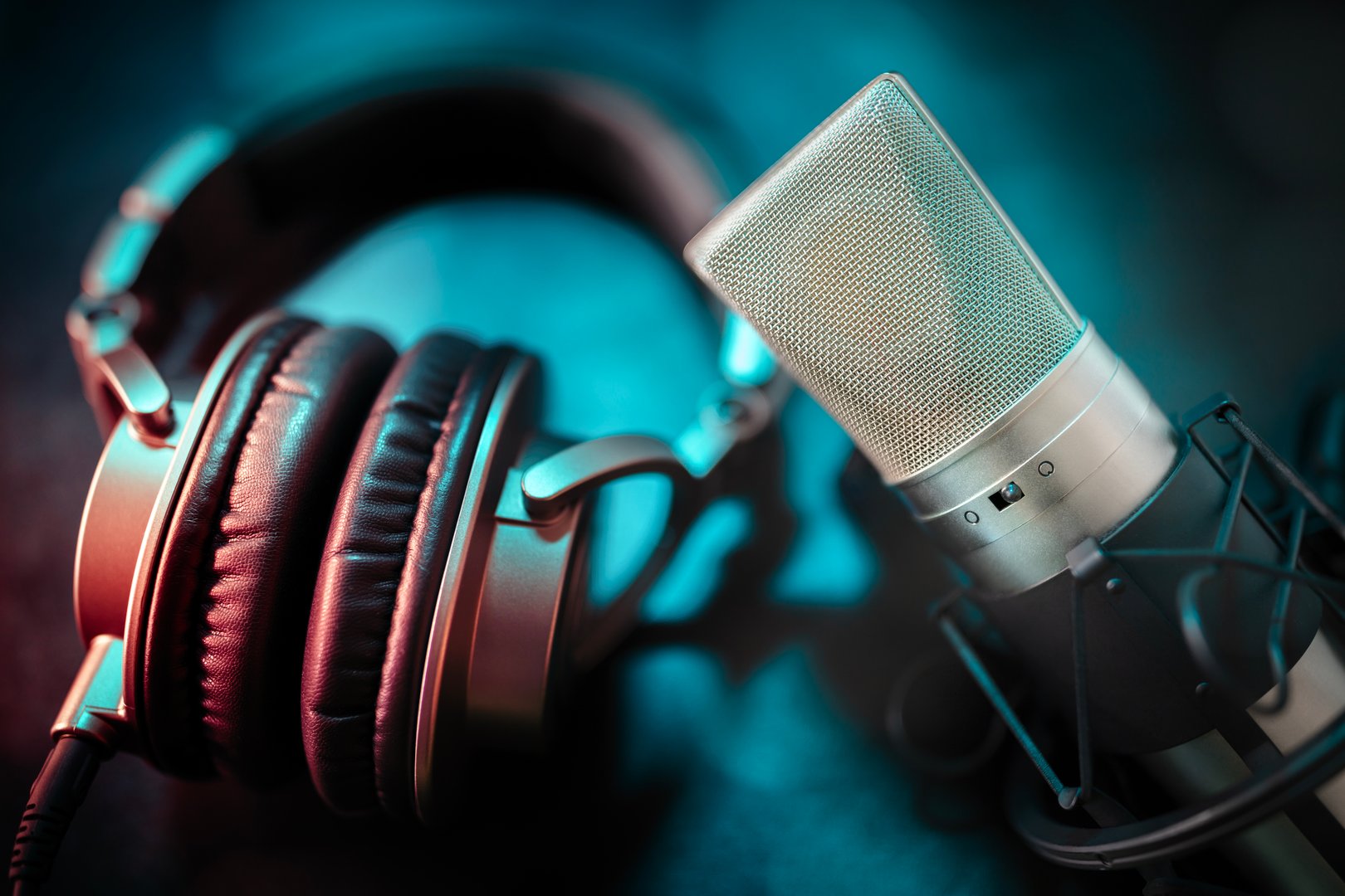 Microphone and headphones close up in recording studio background concept for podcast, music or presentation