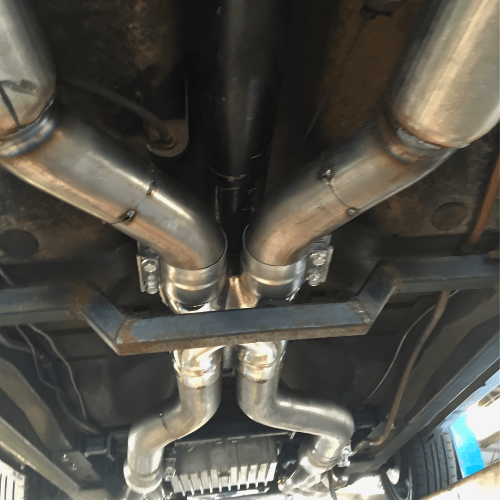 Expert mechanic fabricating custom stainless steel exhaust system at South Geelong Exhausts