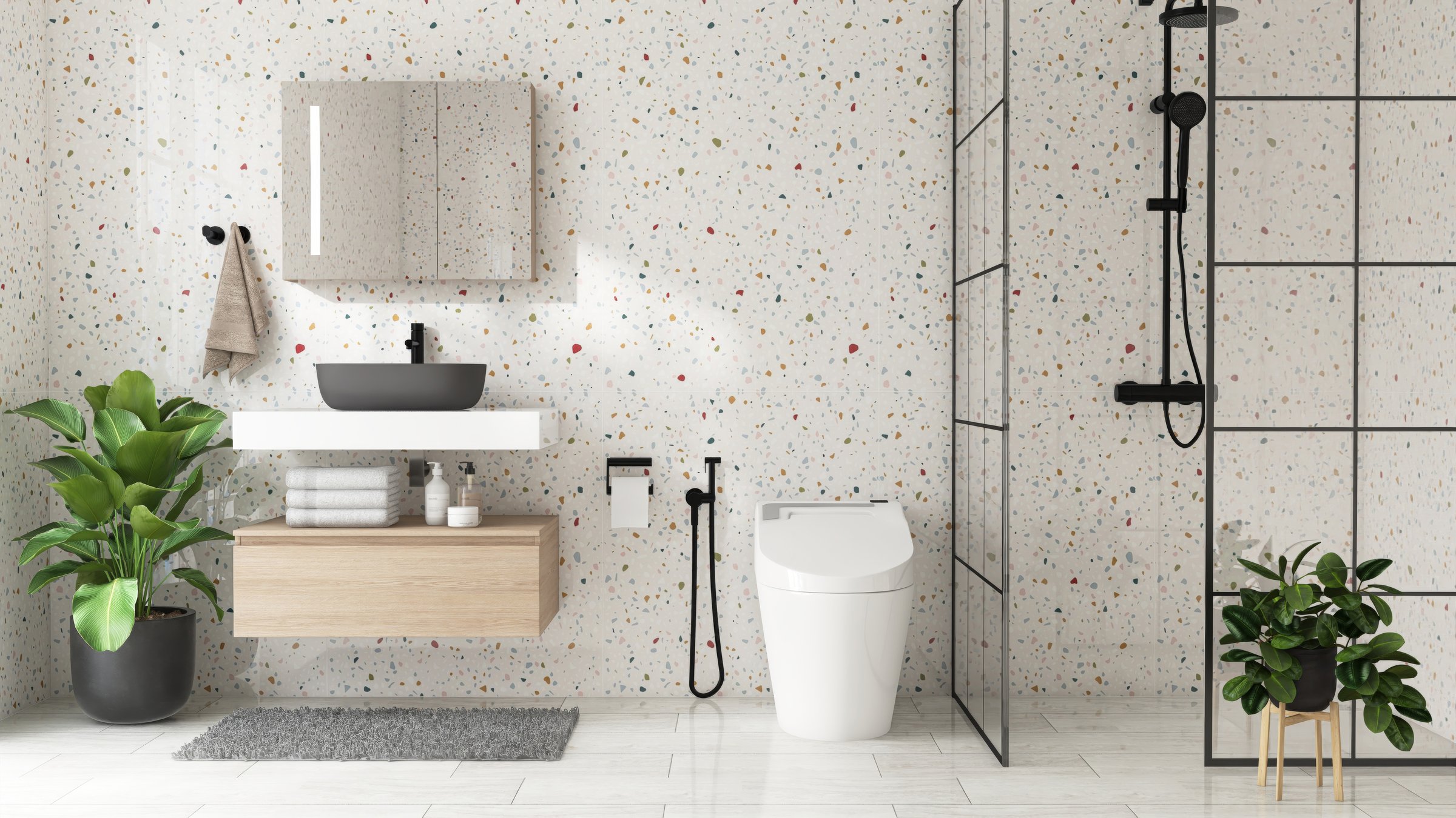 Modern, luxury bathroom with vanity counter, black washbasin, mirror cabinet, partition to shower in sunlight on colorful white terrazzo wall for interior design