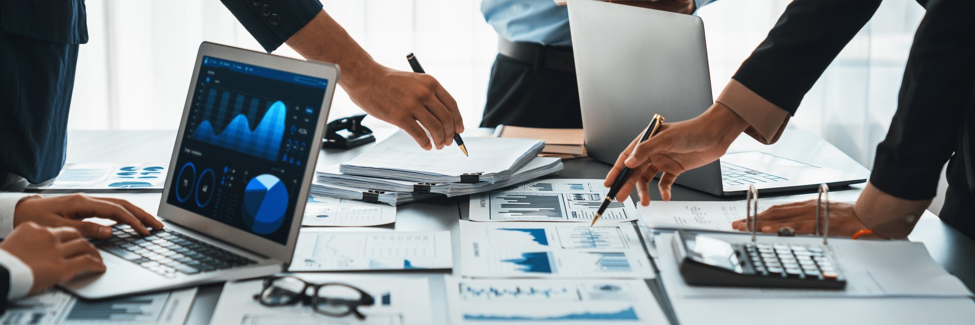 Business intelligence and data analysis concept. Analyst team working on financial data analysis dashboard on laptop screen as marketing indication for effective business strategic planning. Insight