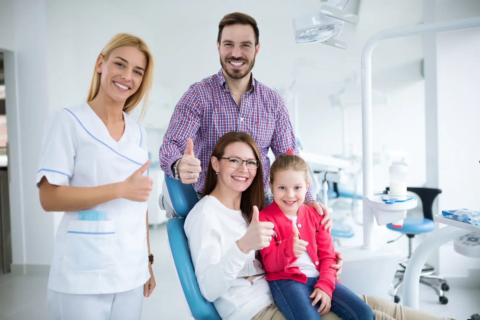 Happy family receiving family-friendly dental care at Labrador dentist with experienced dental professionals
