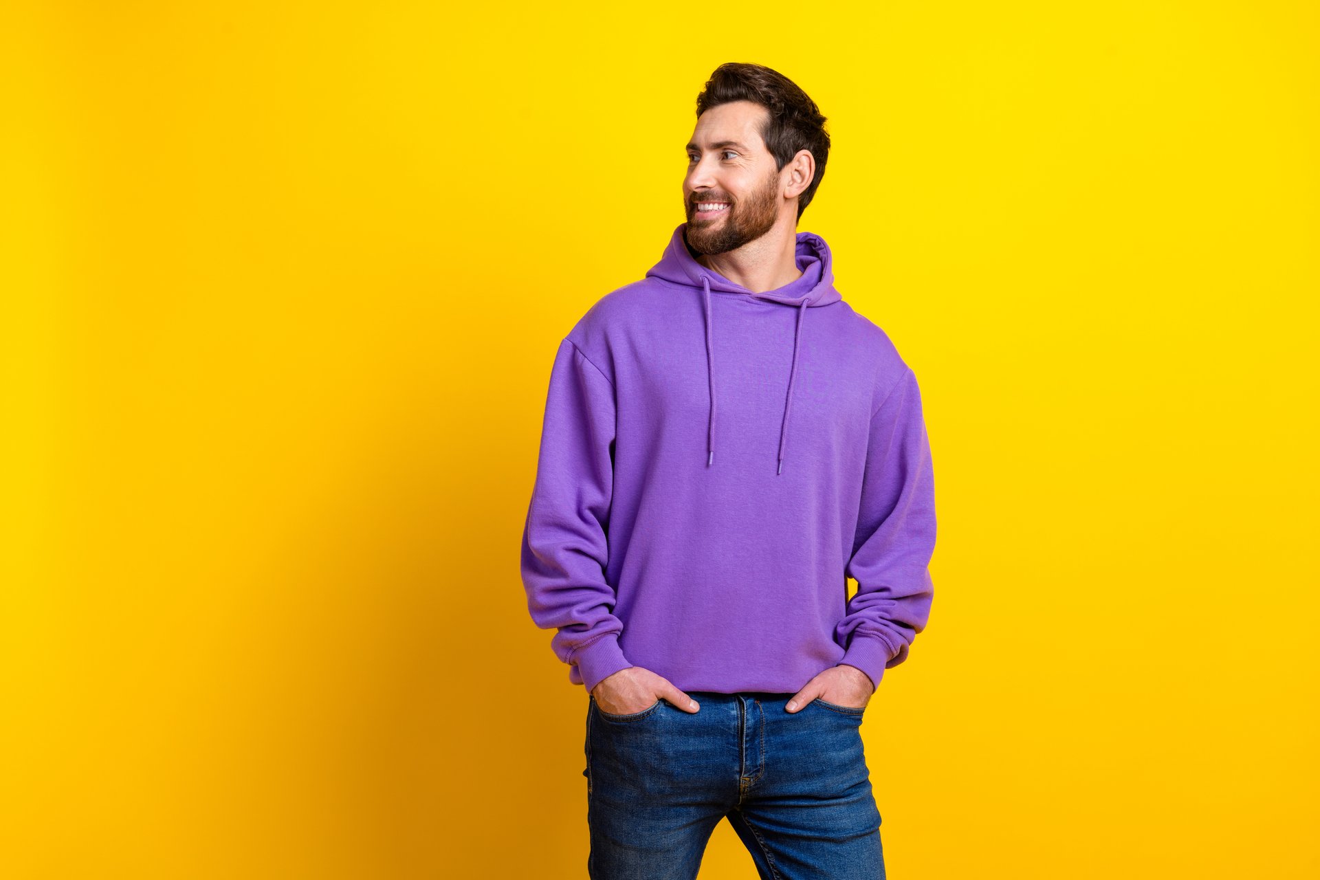 Photo portrait of attractive young man look empty space dressed stylish violet clothes isolated on yellow color background.