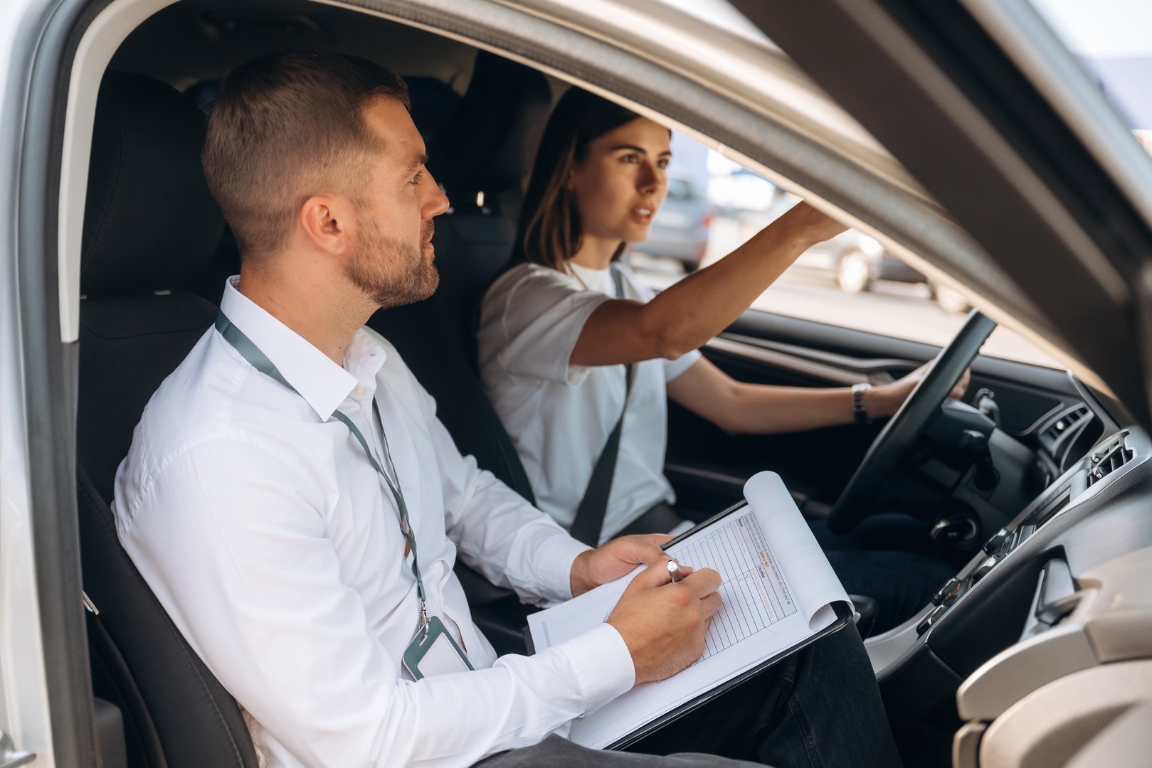 Professional driving instructor teaching student in car - ICBC certified driving lessons in Guildford Surrey near Guildford Mall and 152nd Street