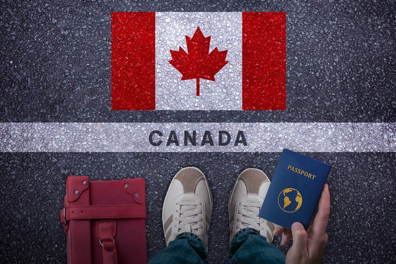 Travel to Canada. Traveler perspective with bag, passport and Canada flag on asphalt road