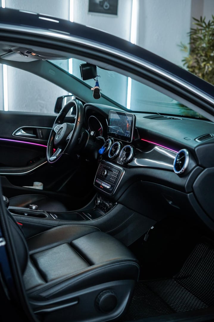 Night lighting cabin of luxury Mercedes EQS SUV  with huge multimedia screen MBUX. View from the outside. Katowice,Poland - 28.05.2023