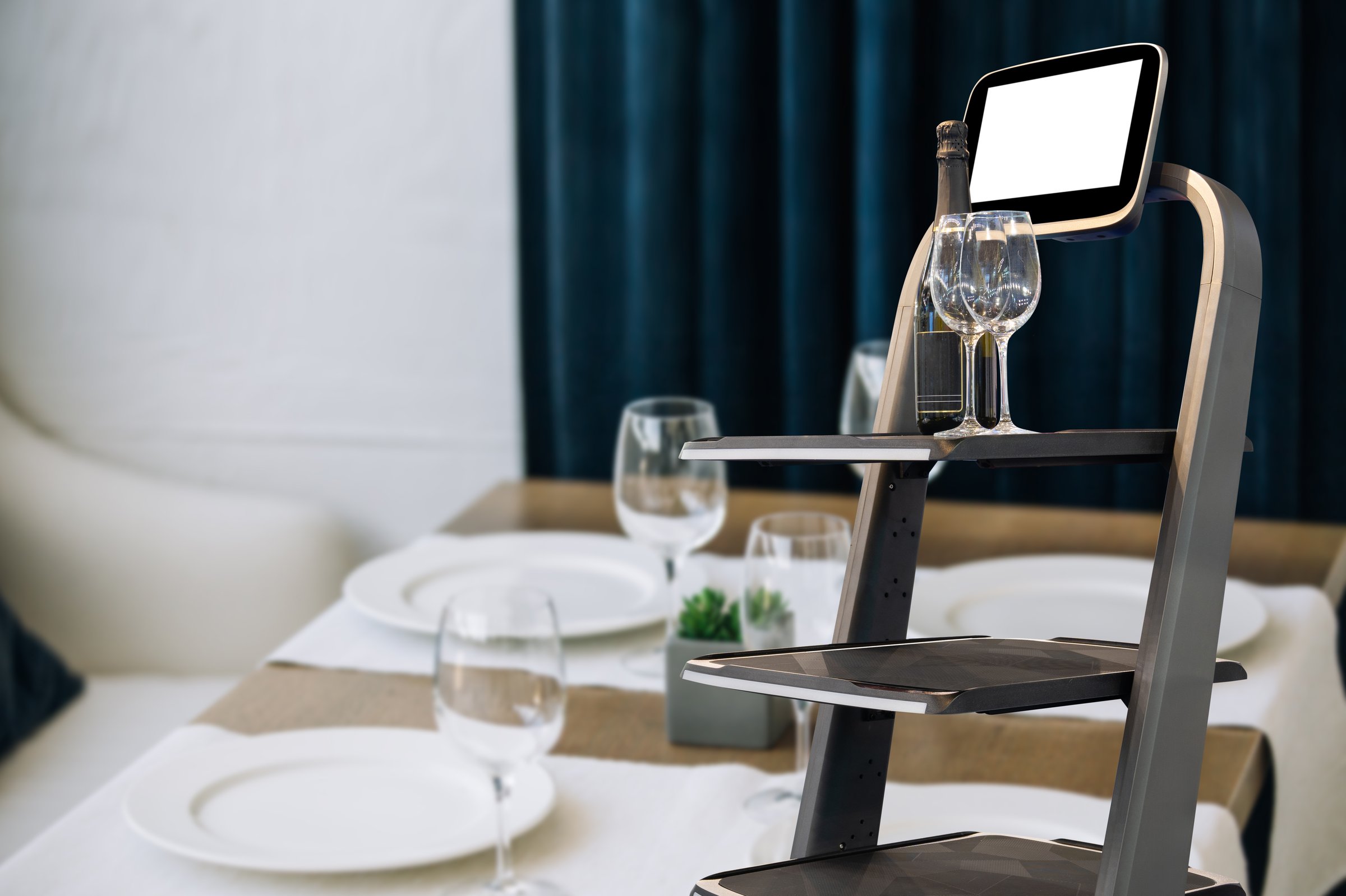 Robot waiter works in restaurant.