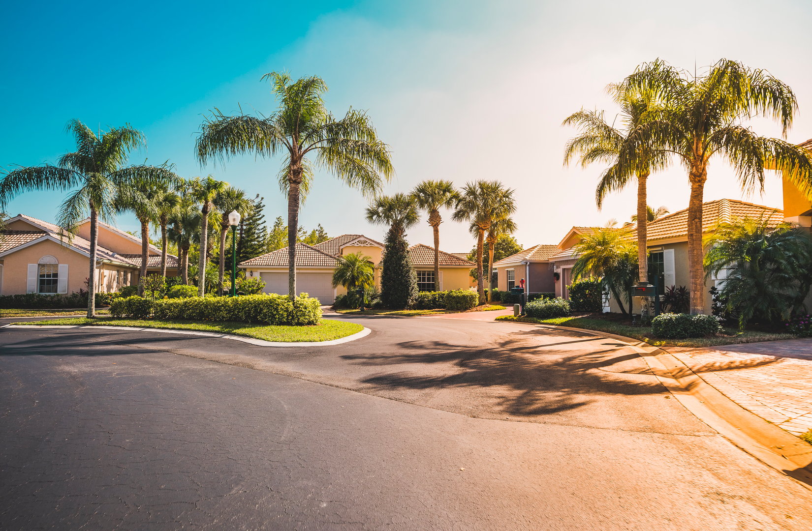 Typical gated community houses with palms, South Florida. Light effect applied
