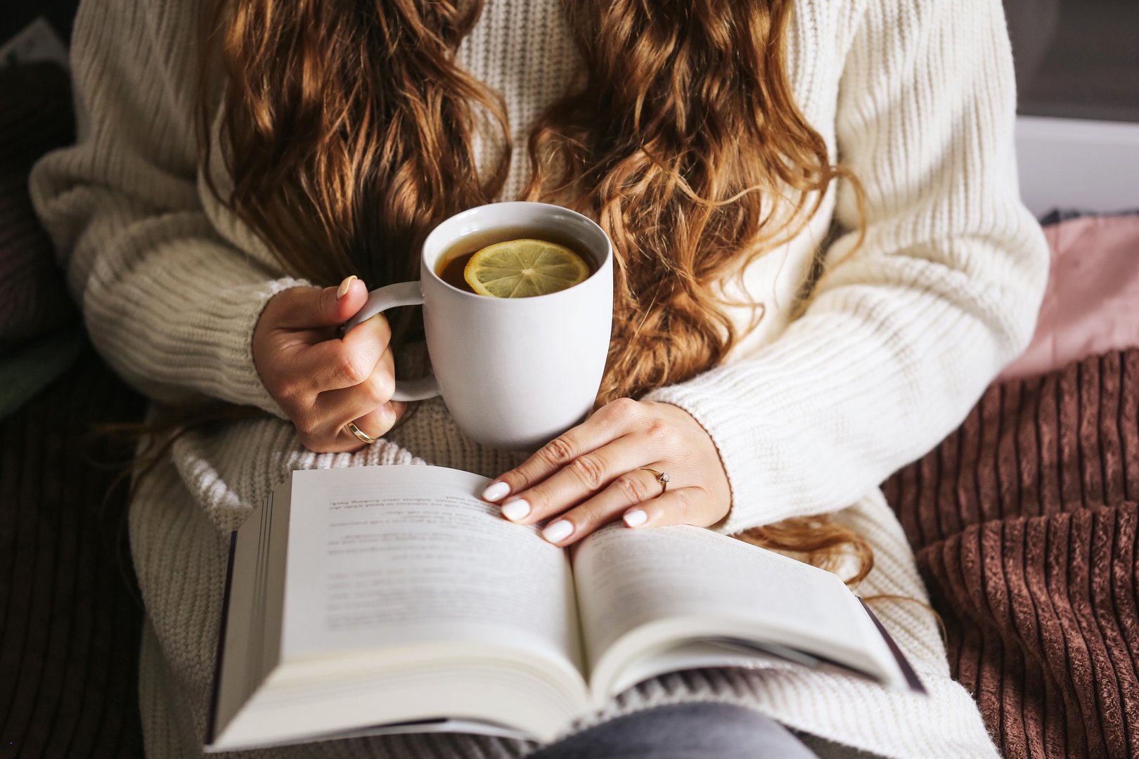 Relaxed weekend moment with warm sweater and soft blanket