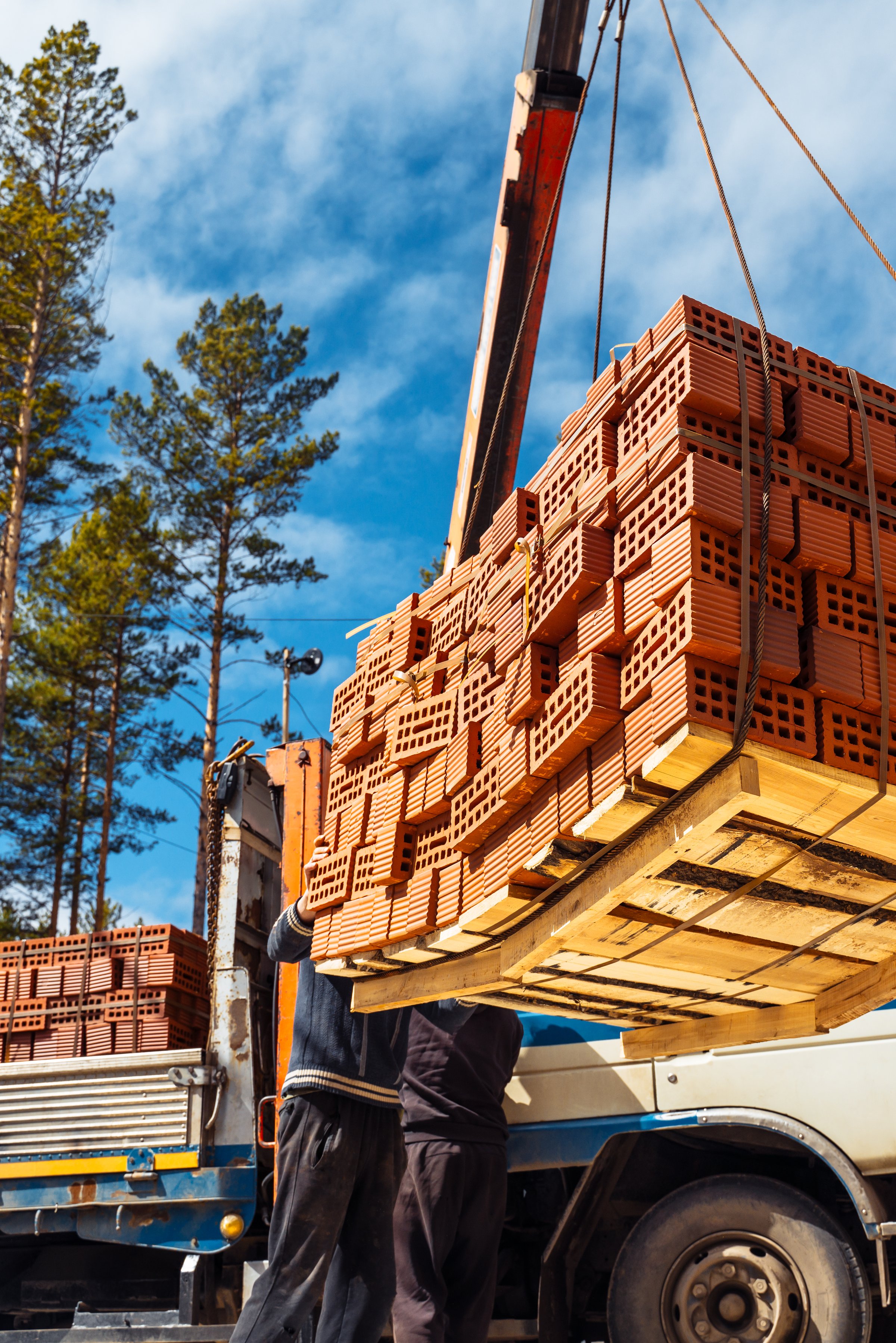 Workers unloading materials