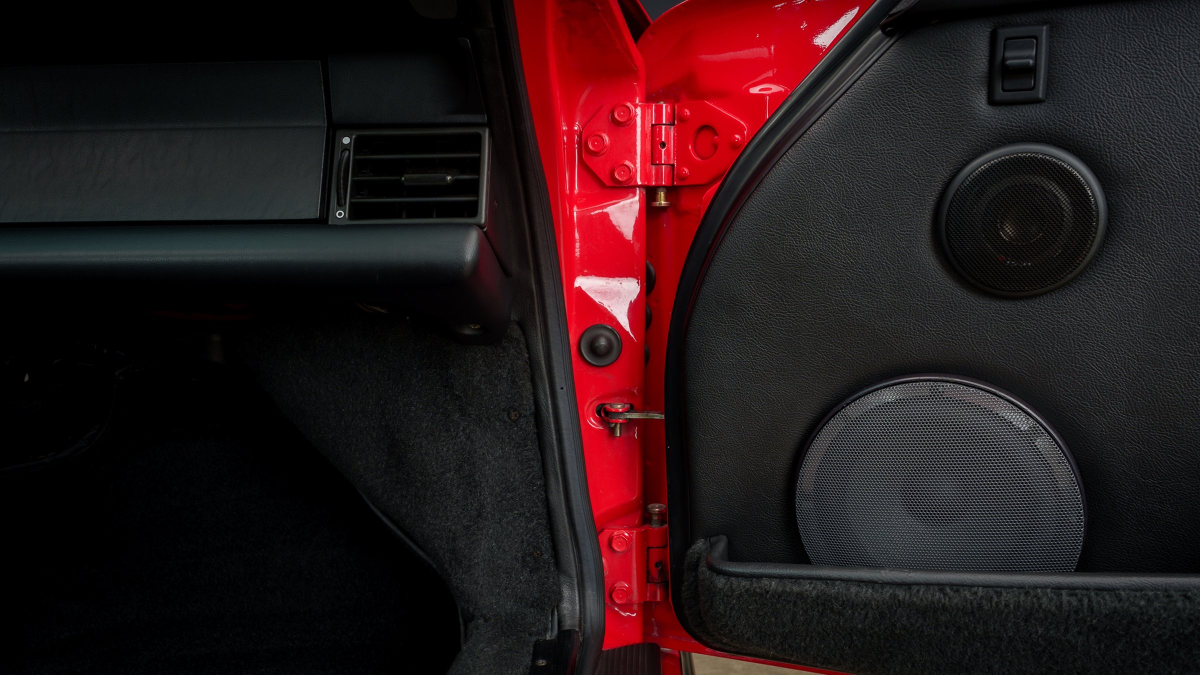 Passenger door card on a red car