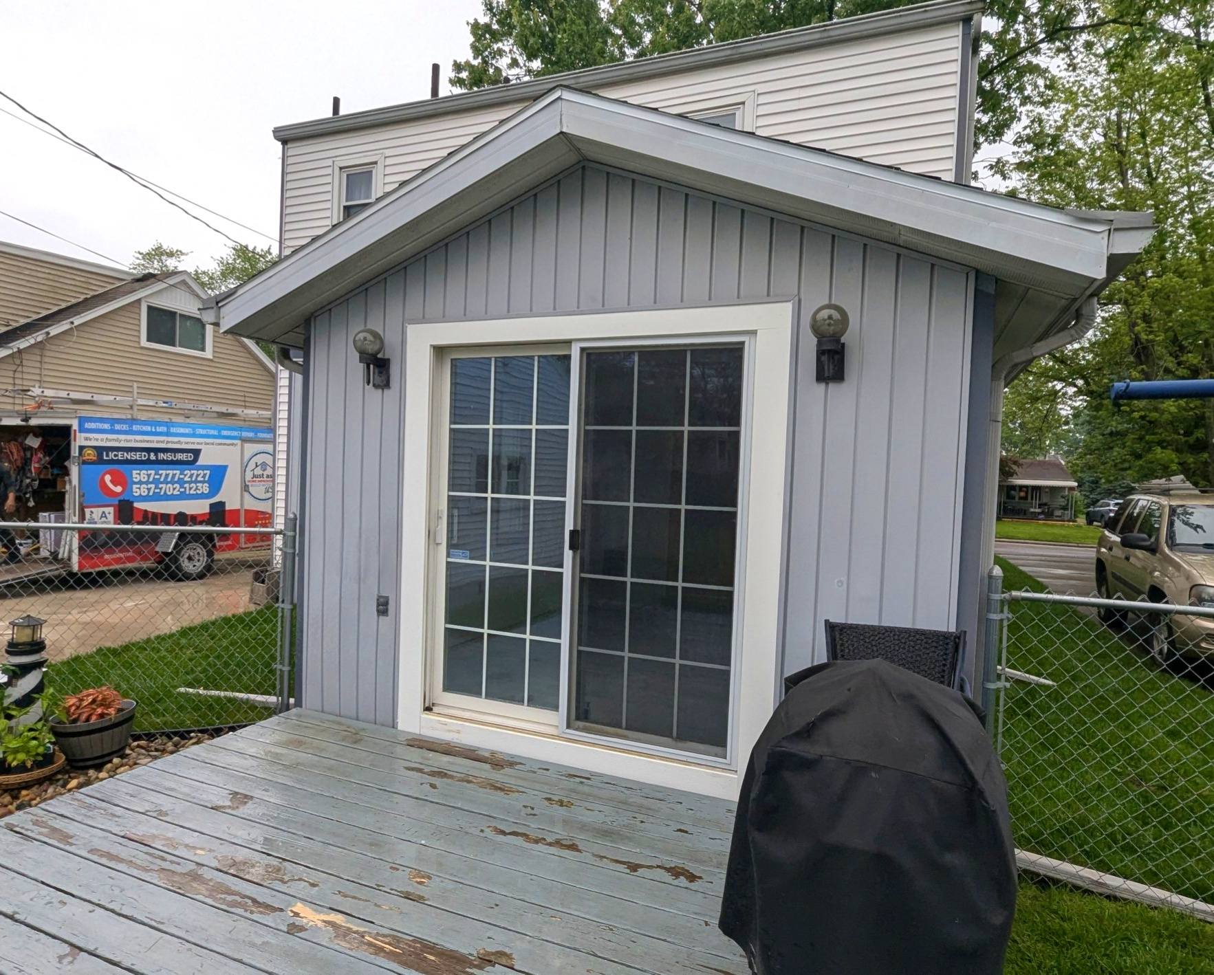 Foundation on concrete blocks for a wooden frame house, providing structural stability with black waterproofing on the wooden frame