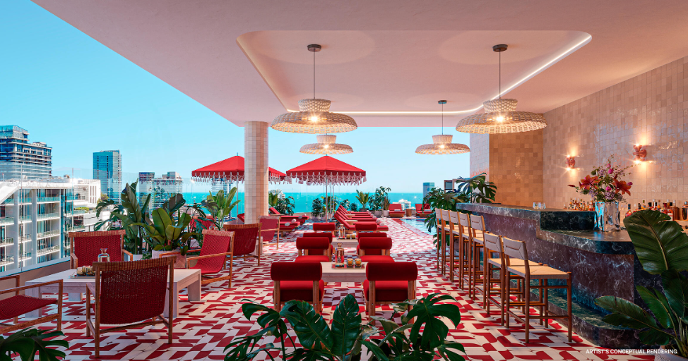 Rooftop bar with red and white decor, ocean views, and tropical plants. Red umbrella tables and a marble bar are featured.