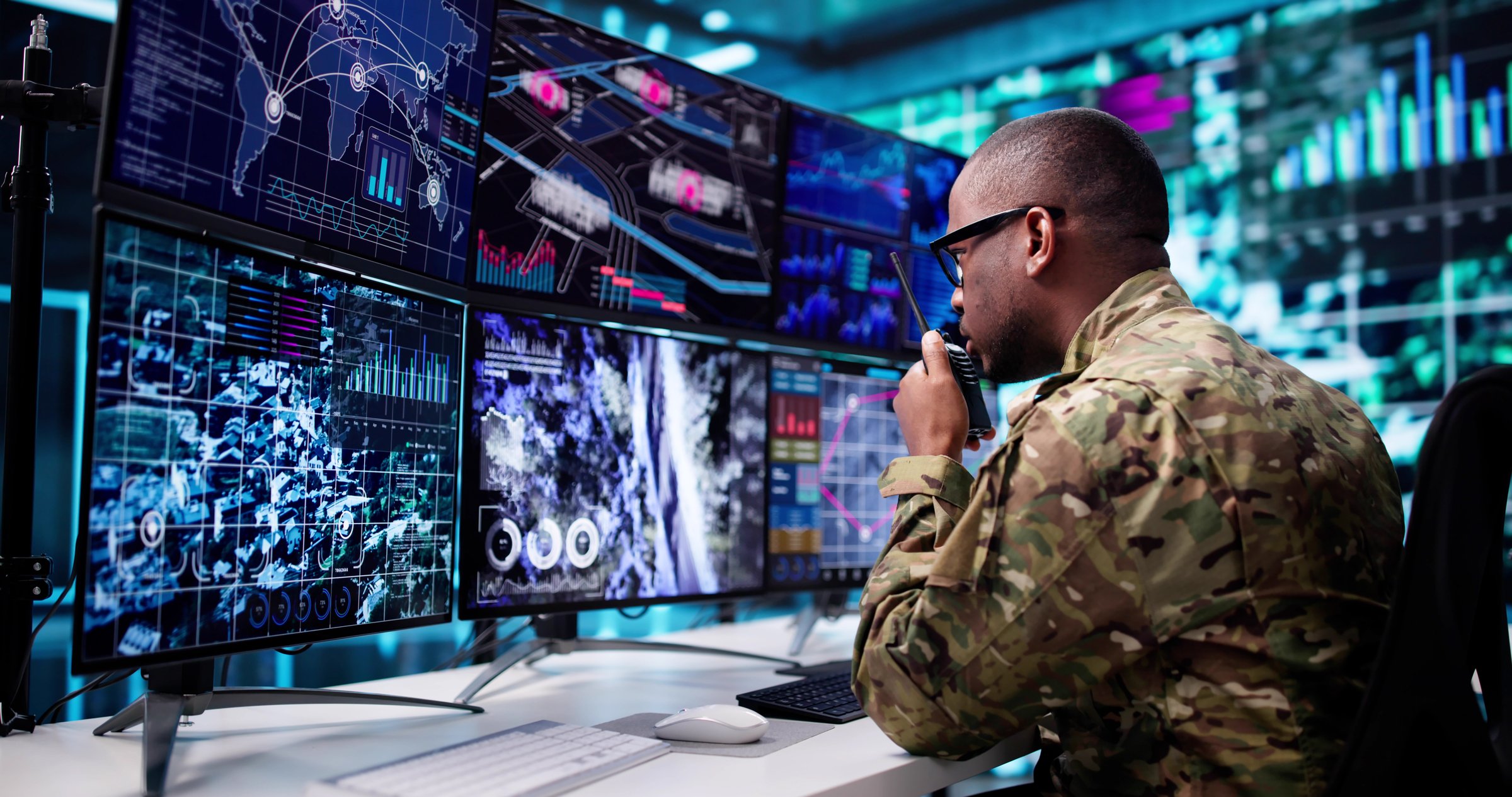 Army Soldier Controls CCTV Camera Screen In Military Command Surveillance Center.