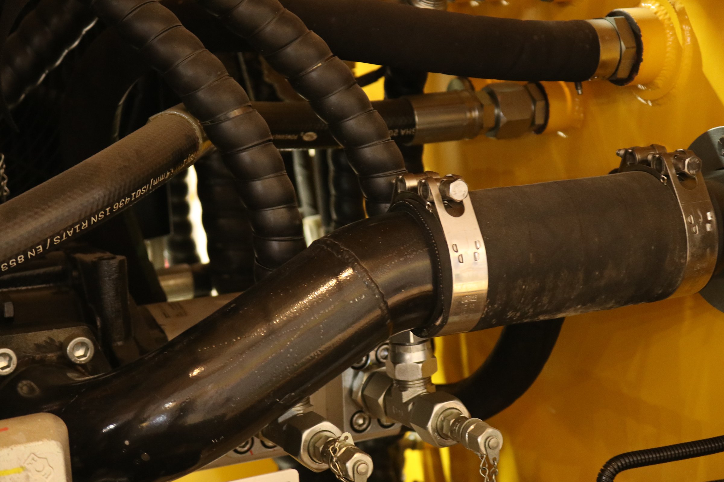 Photo of hoses and cables in an industrial machine