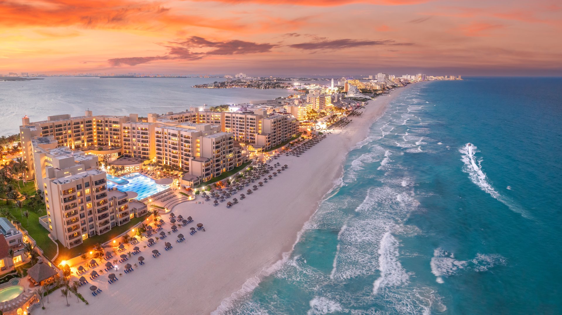 Stunning aerial view of Cancun Hotel Zone with luxury all-inclusive resorts along pristine Caribbean coastline