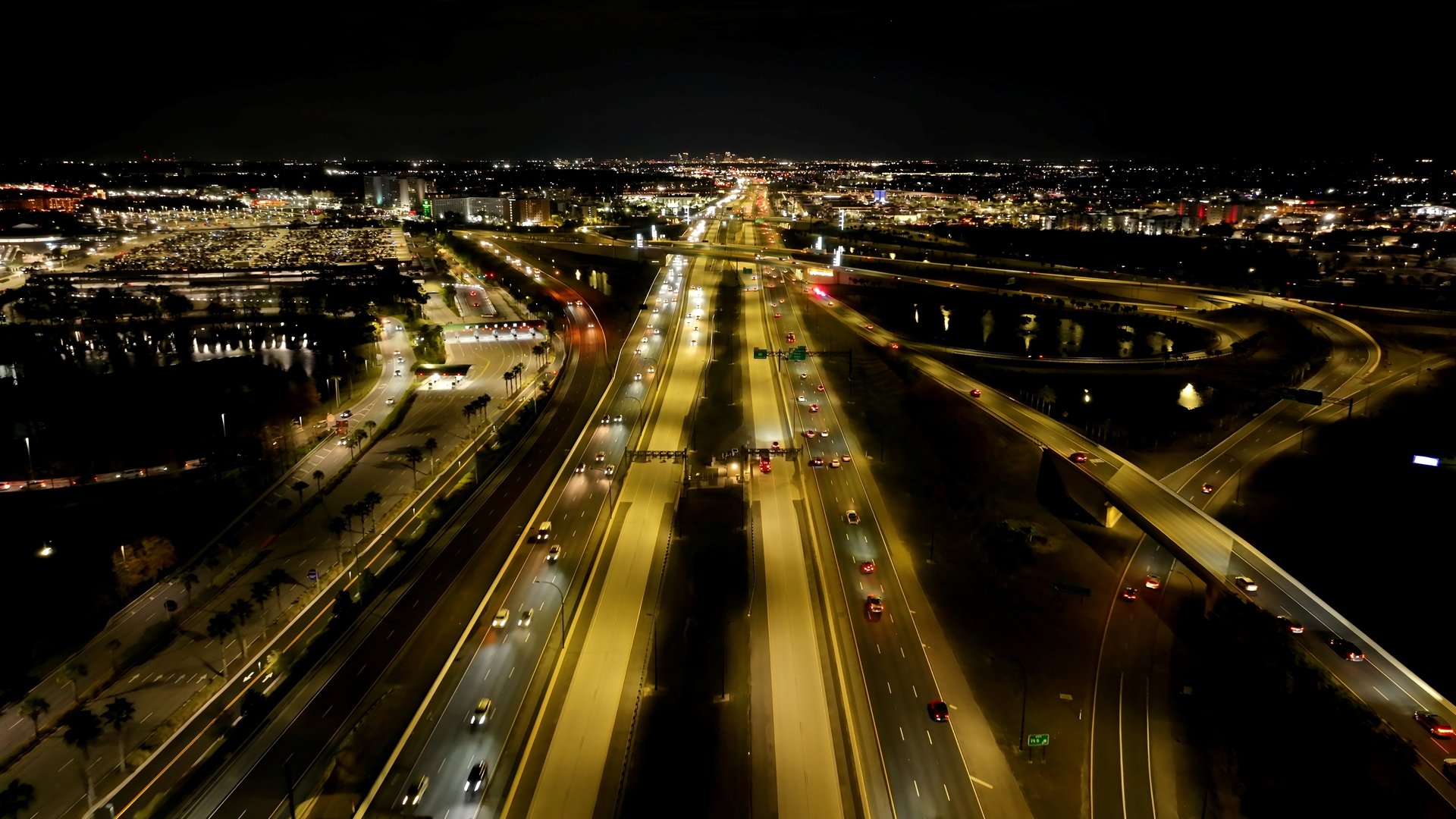 Orlando Skyline At Orlando In Florida United States. Illuminated Highway Road. Traffic Scene. Night City Scenery. Florida United States. Orlando Skyline At Orlando In Florida United States.