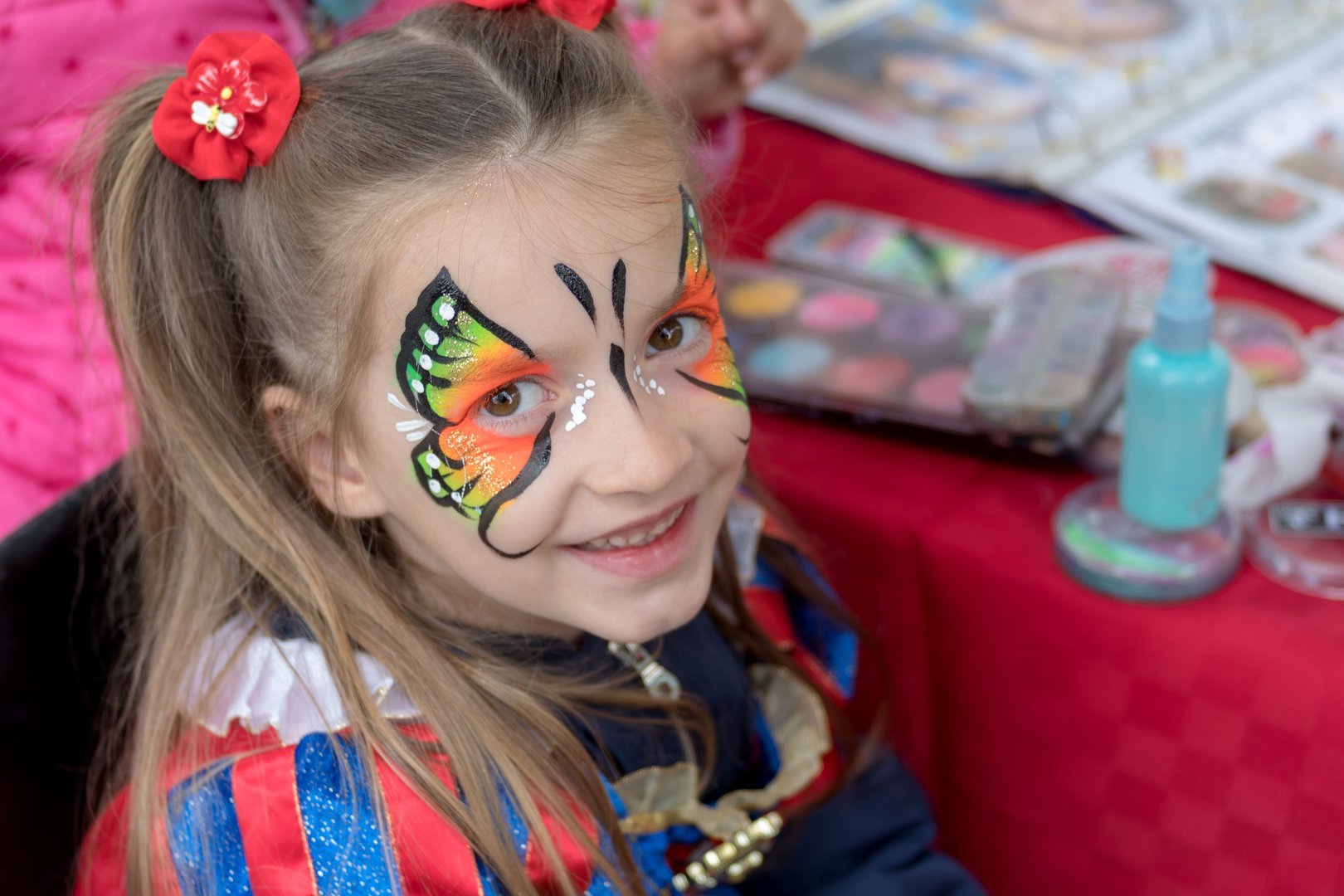 Girl with butterfly painted on face