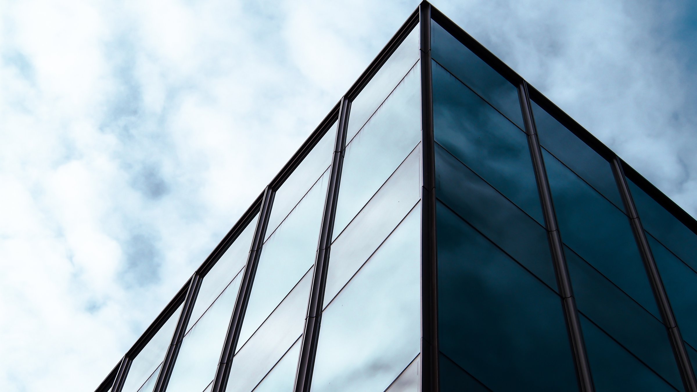Minimalist Reflection Sleek Glass Facade with Subtle Sky Reflections, Perfect for Architectural Branding, Urban Aesthetic Studies, or Modern Design Showcases