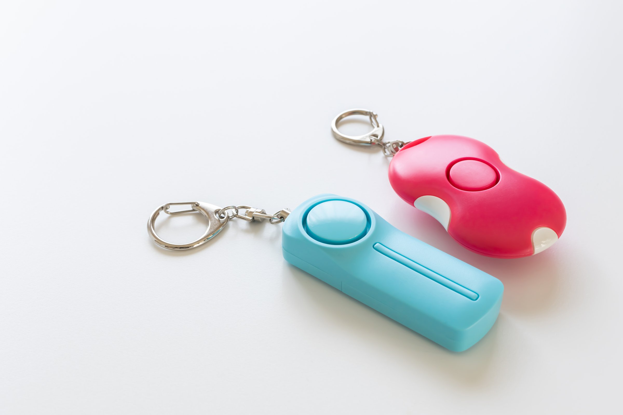 Personal alarm. Security buzzer. Security bell. White background.