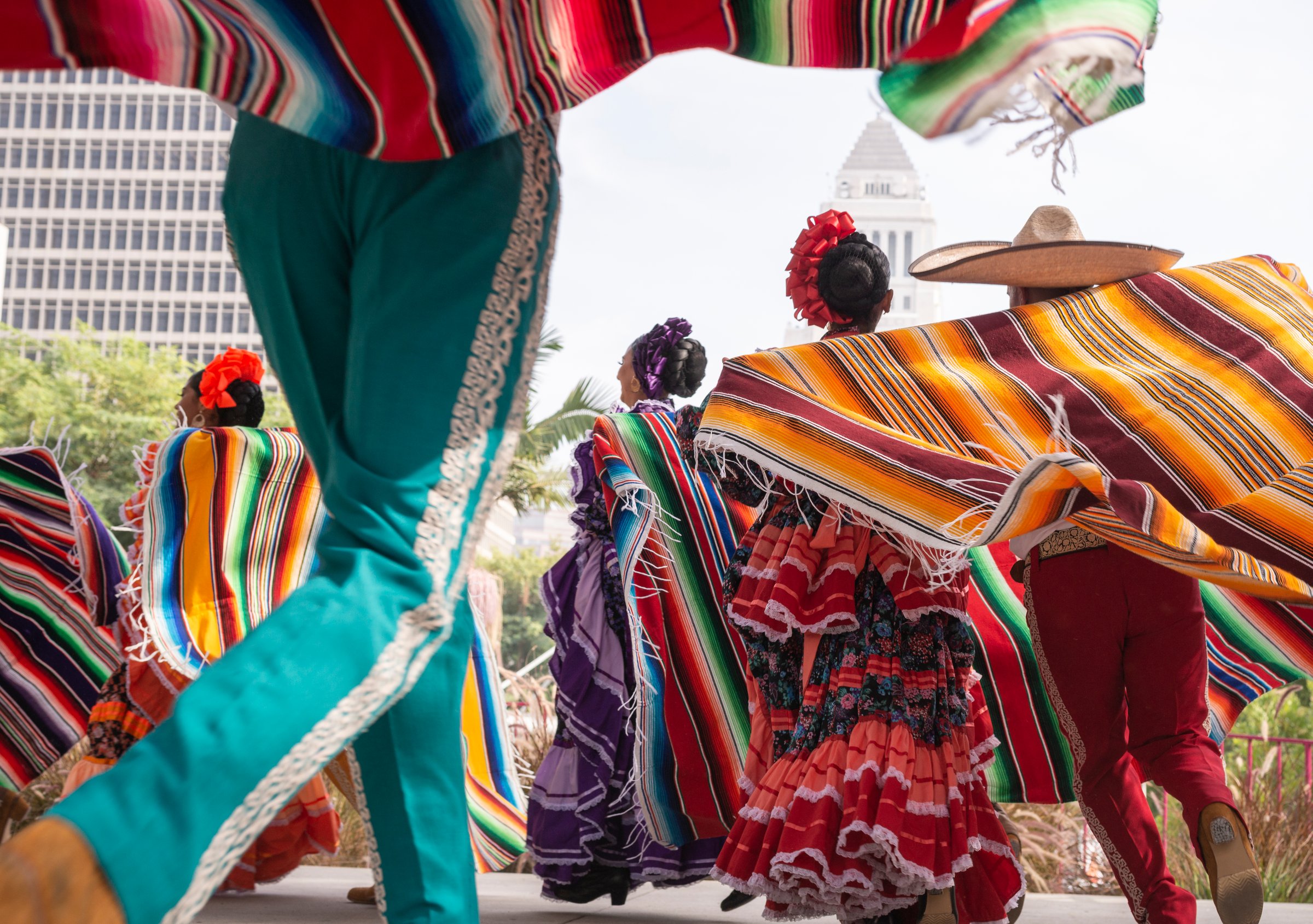 Los Angeles, CA, USA - October 25, 2025: Folkloric dancers perform on stage during Día de los Muertos (Day of the Dead) a free event in Gloria Molina Grand Park with LA city hall in the background. The event included a public displays of altars of loved ones.
