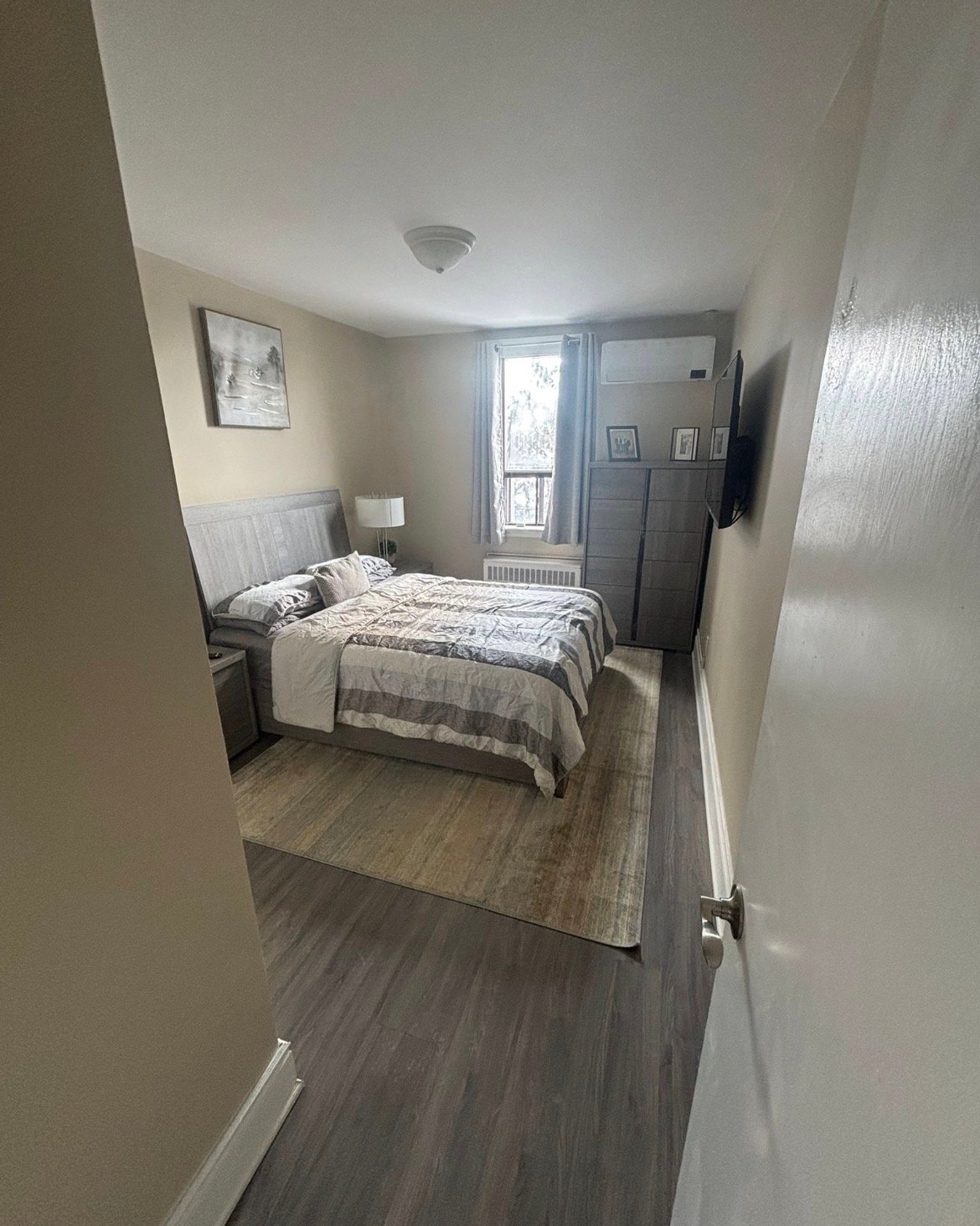 Bedroom before painting - plain neutral walls