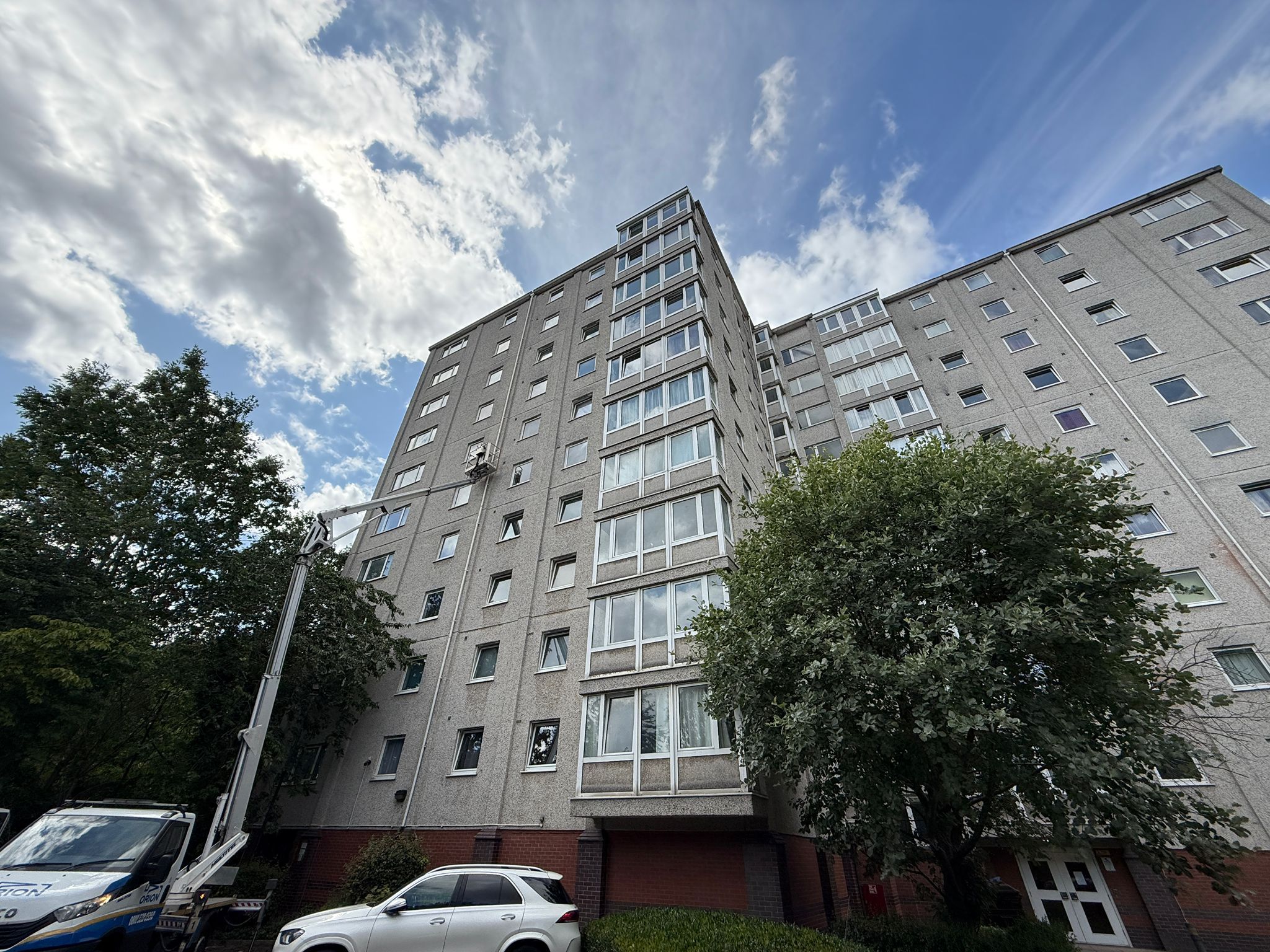 Fire safety inspector conducting external wall assessment