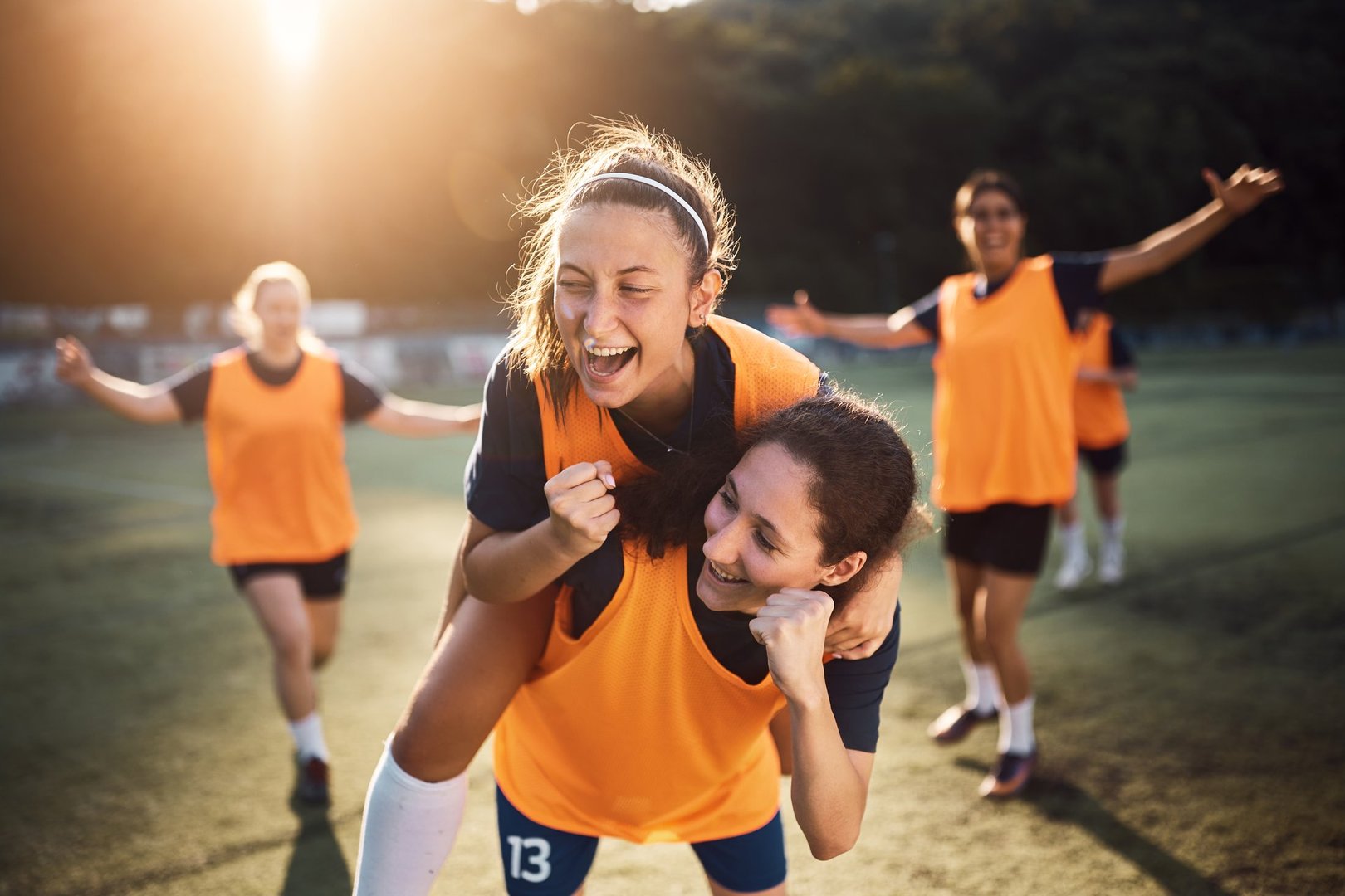 Happy female players celebrating a goal