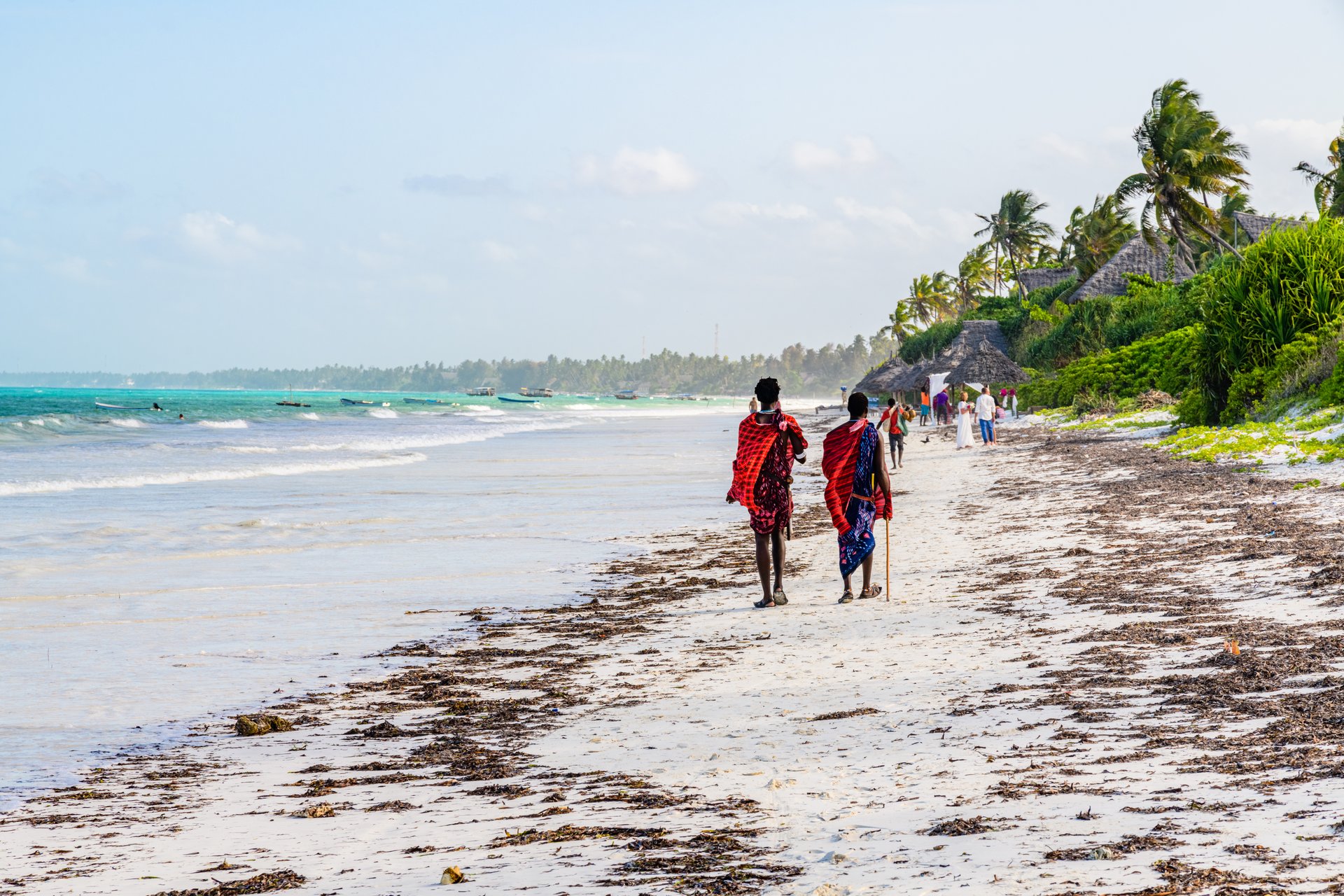 Two young maasai men at beach. Zanzibar, Tanzania