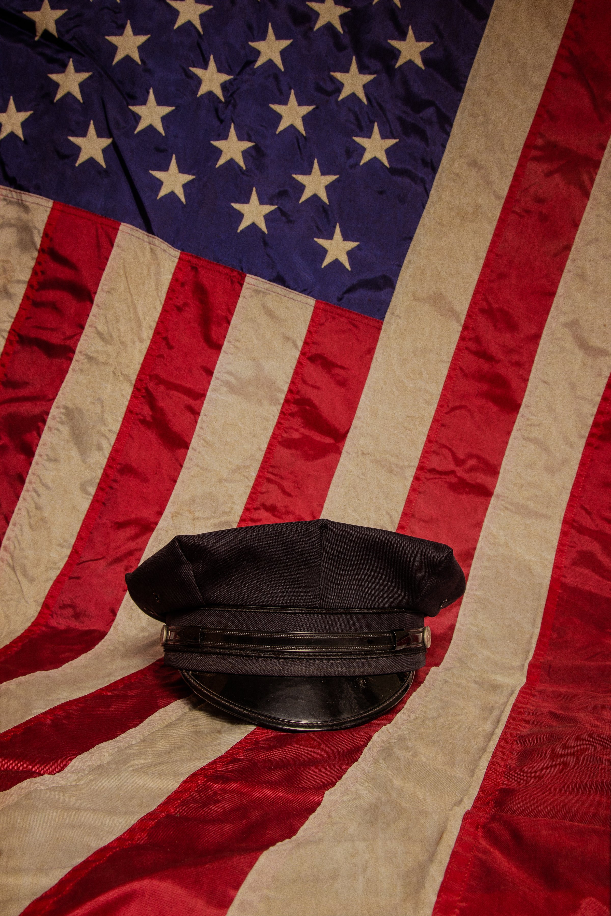 A police hat with an American Flag.