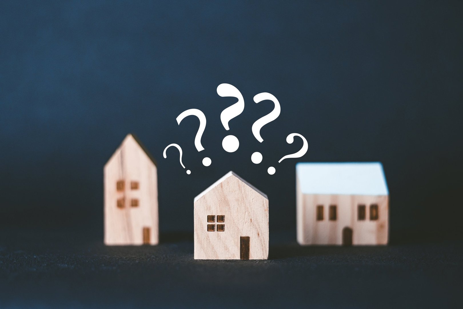 Wooden house and question mark
