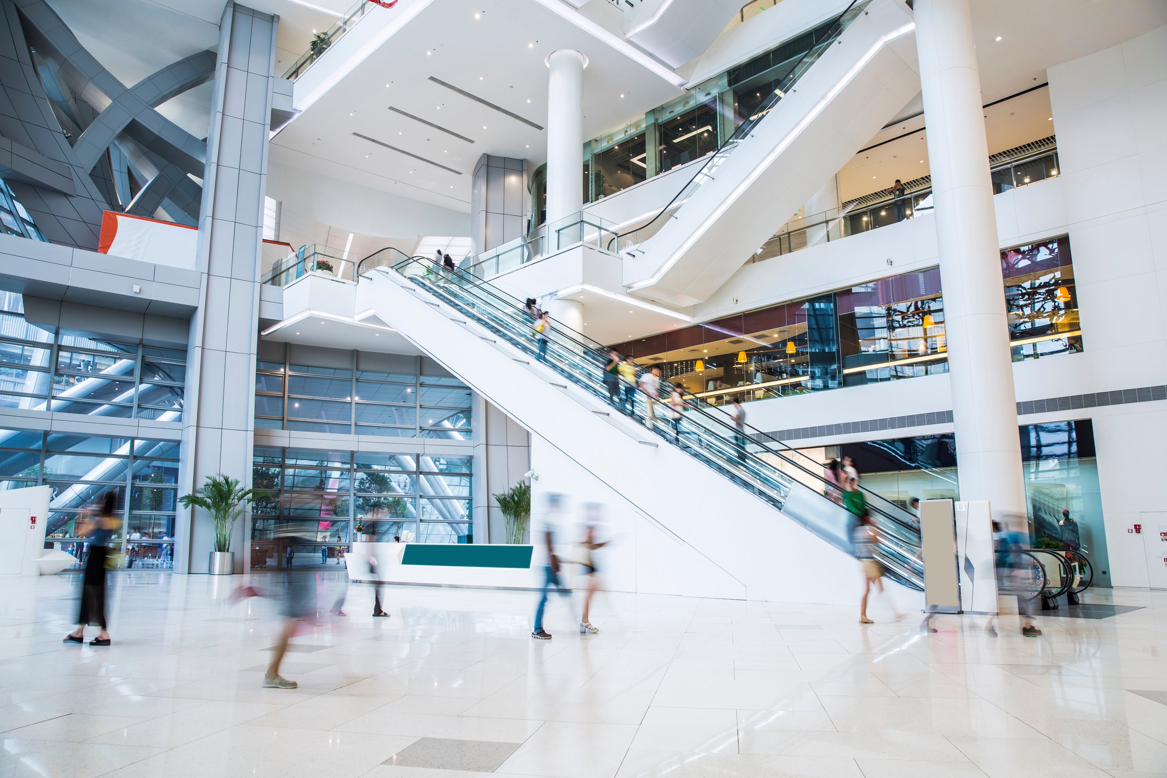 busy shopping mall, long exposure time, shoppers moving are deliberately blurred