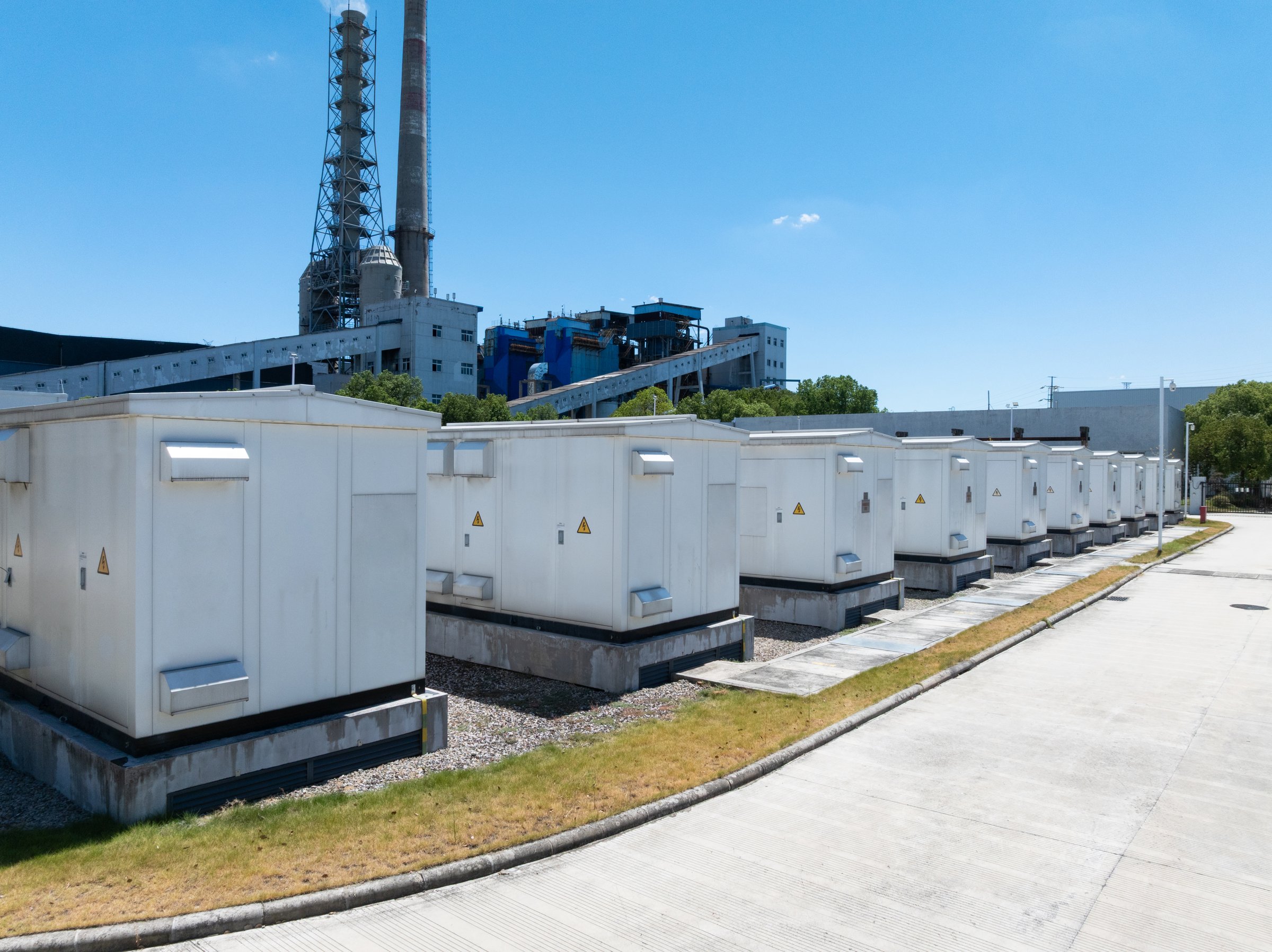 Aerial view of battery energy storage systems under a clear blue sky