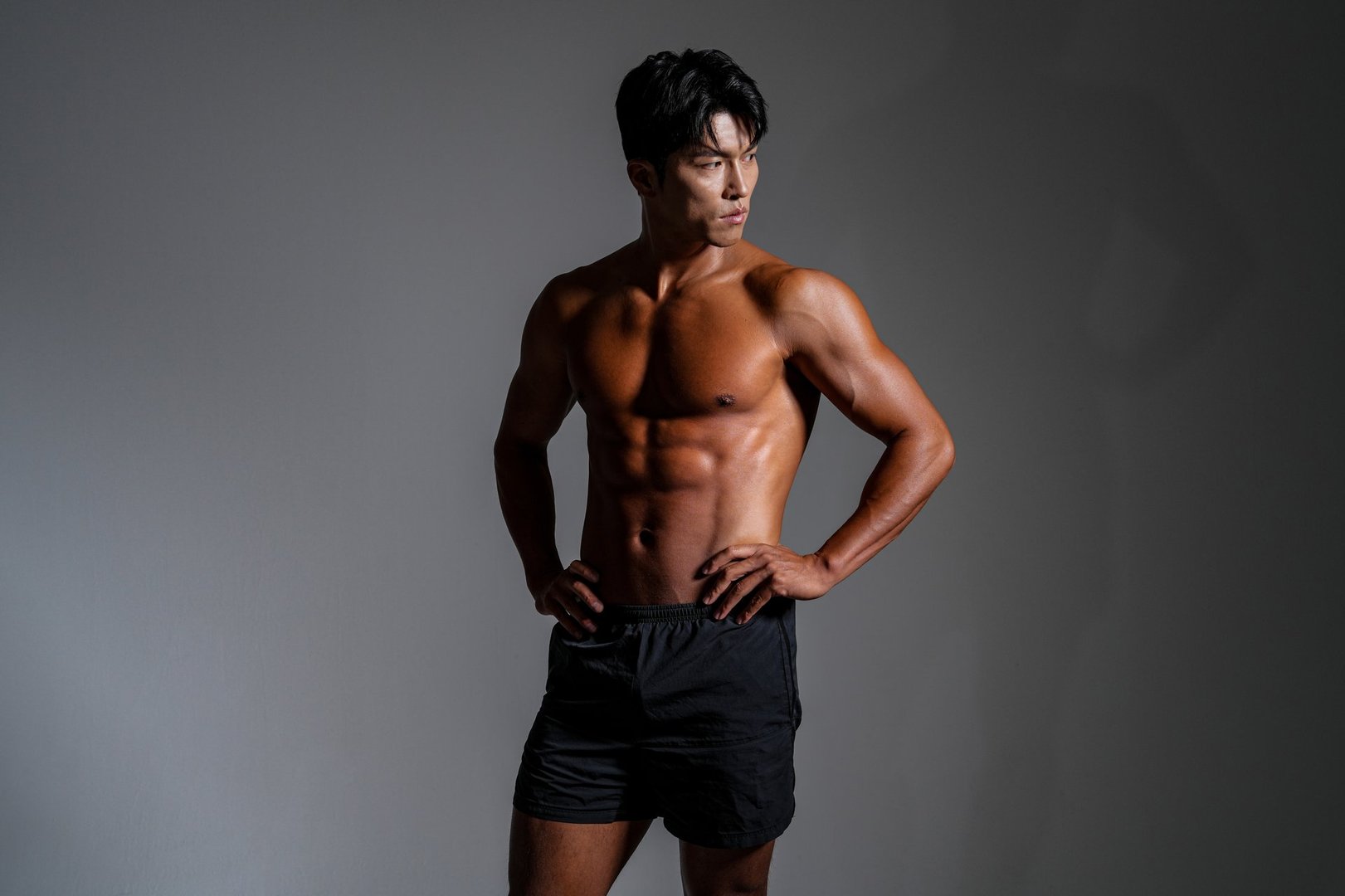 studio shot - fitness image of an Asian male