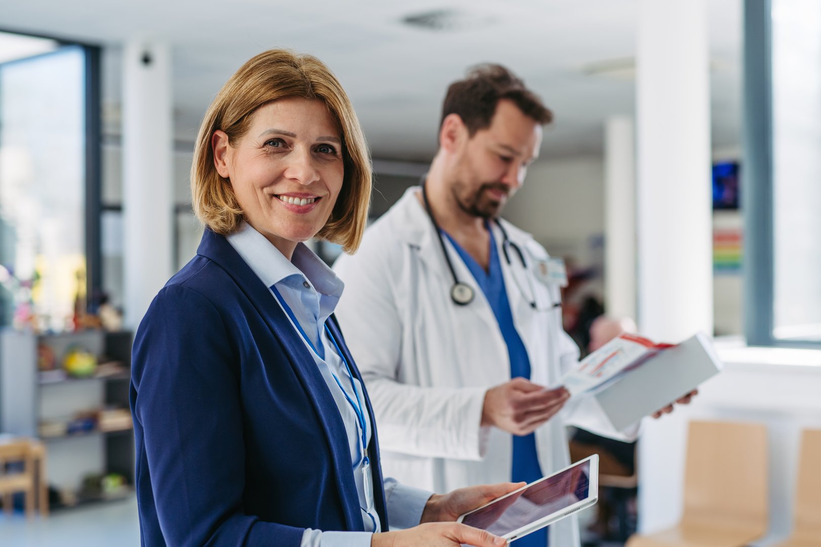 Pharmaceutical rep meeting with healthcare professional to discuss new drugs, medications.