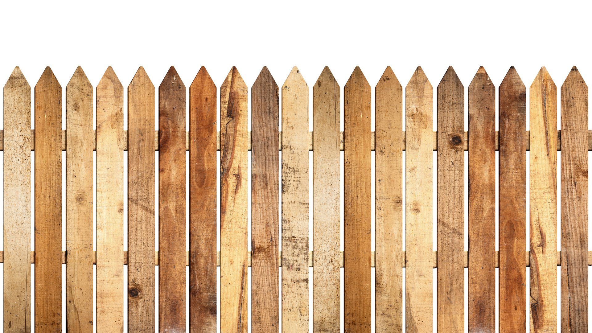 Closeup view of a weathered wooden garden fence panel isolated over a white background. Copy space or template
