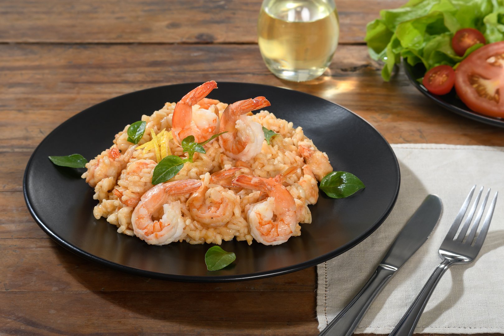 Delicious Shrimp Risotto Plated on Black Plate
