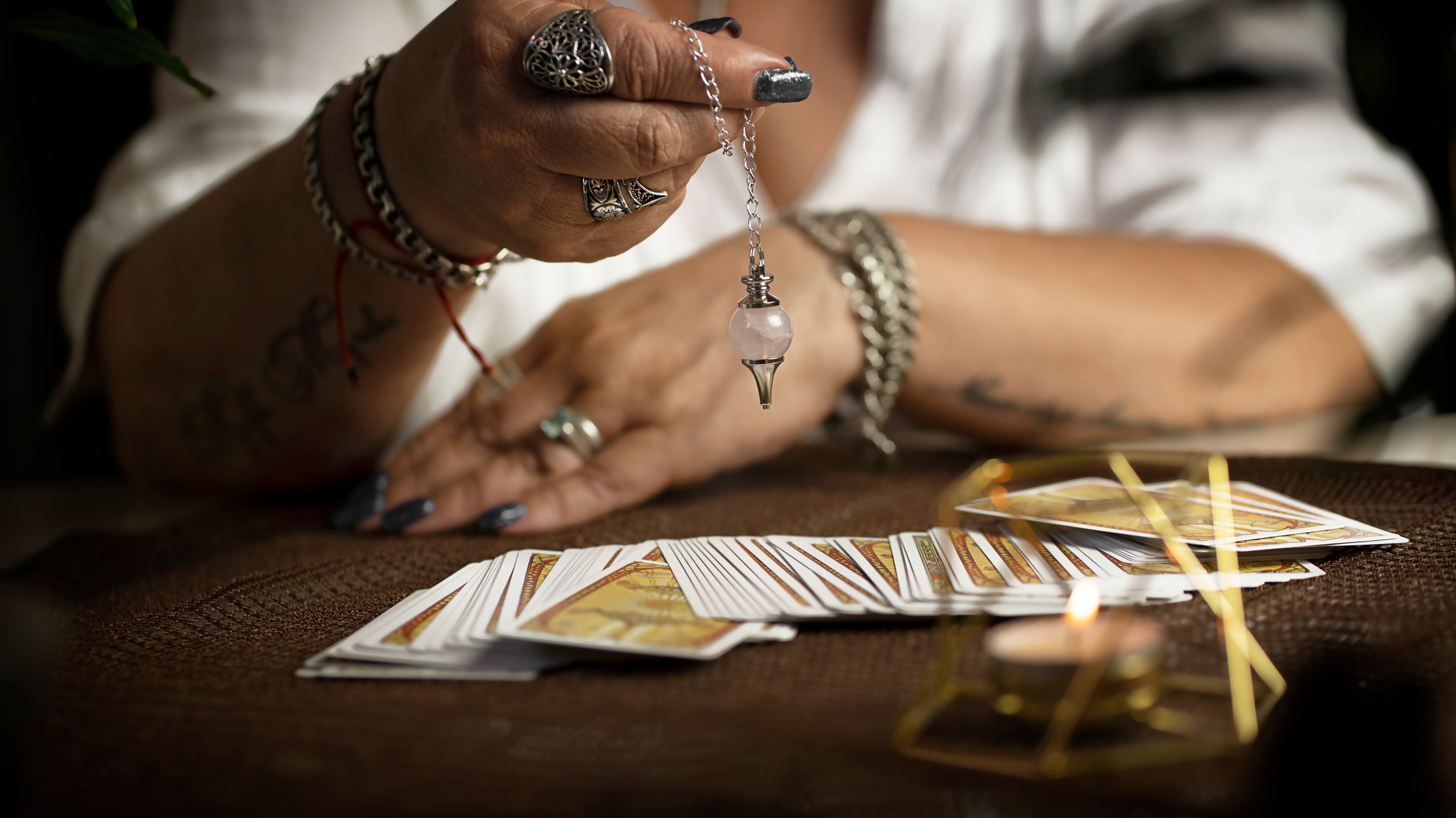 Tarot cards on wooden table. Fortune teller table.