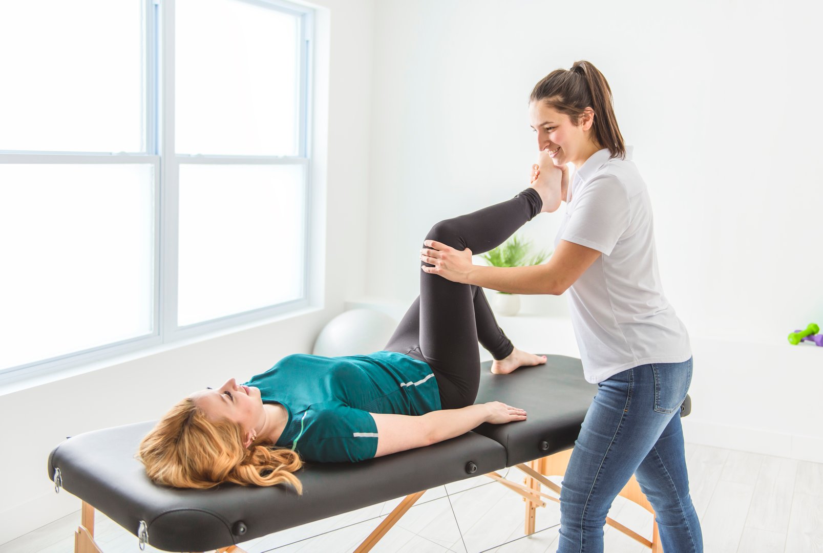 A Modern rehabilitation physiotherapy at work with client