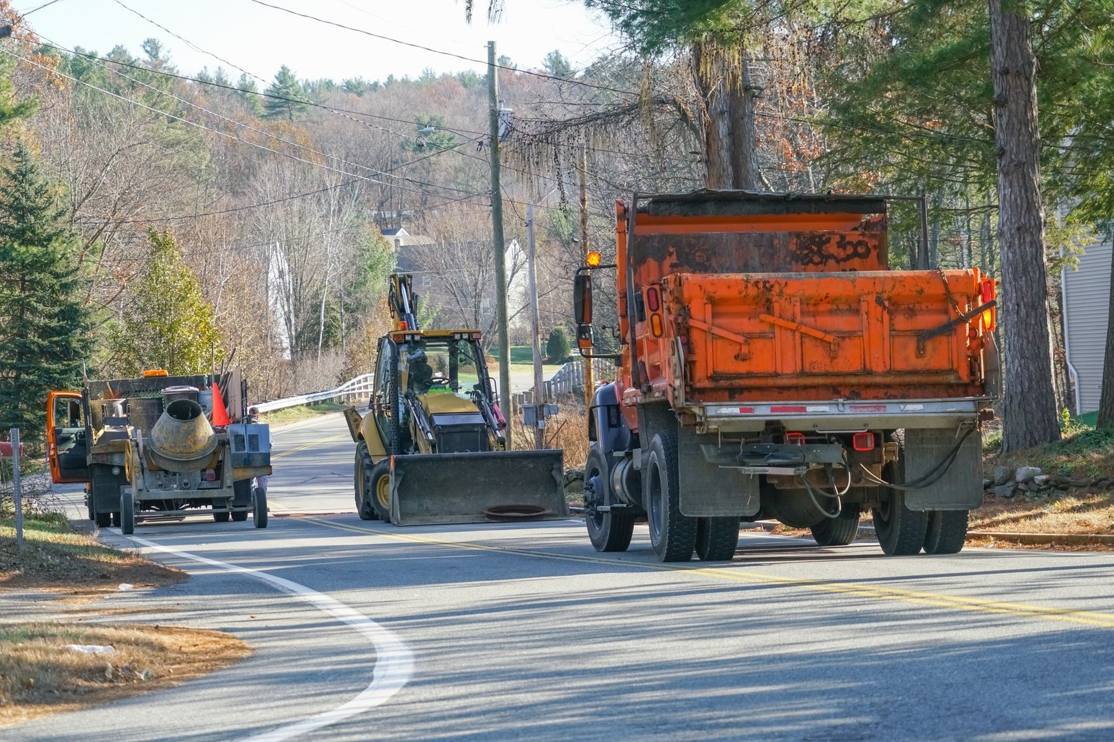 road construction vehicles and equipment on residential street