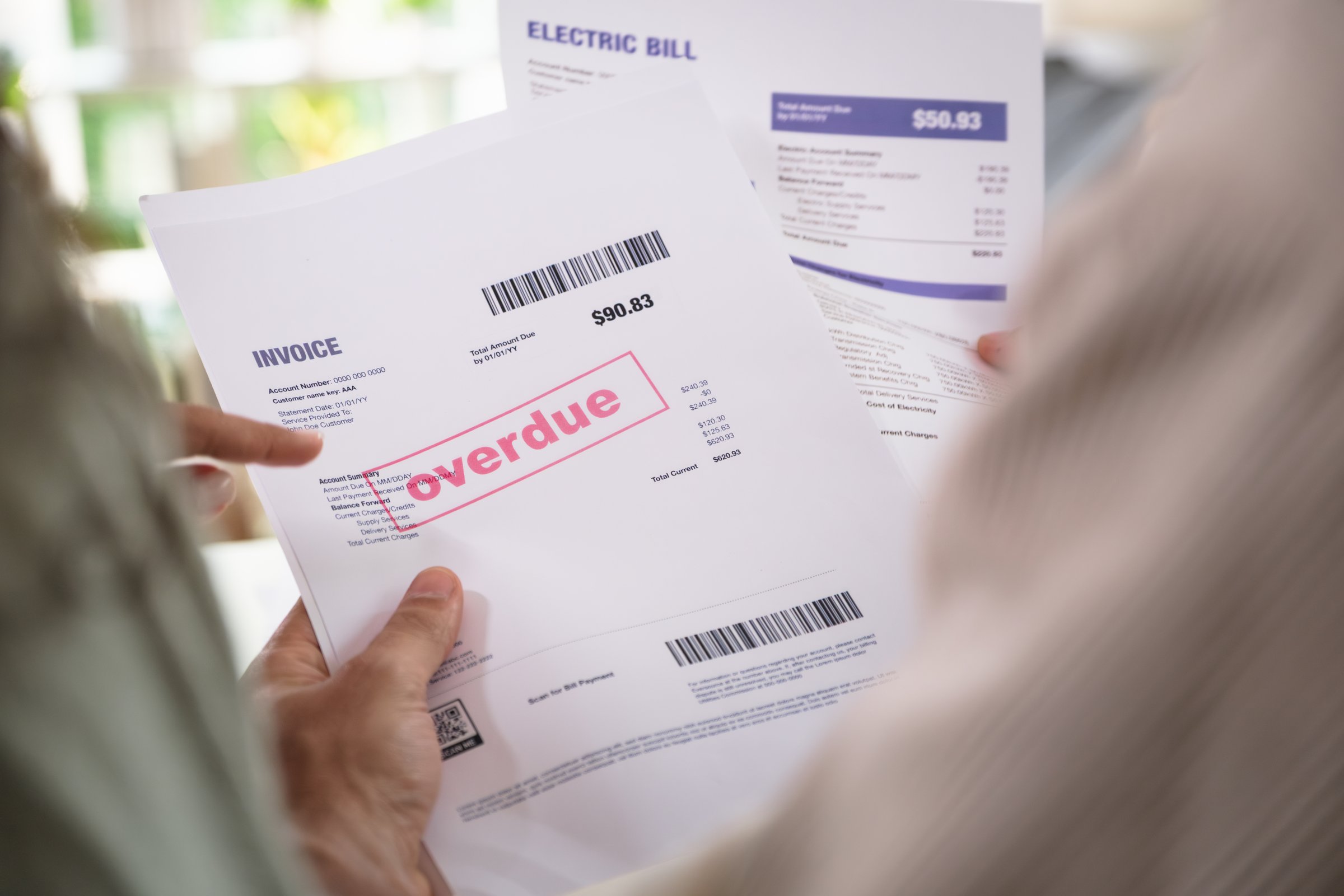 Couple facing overdue bills and financial pressure at home, stressed by inflation and economy recession