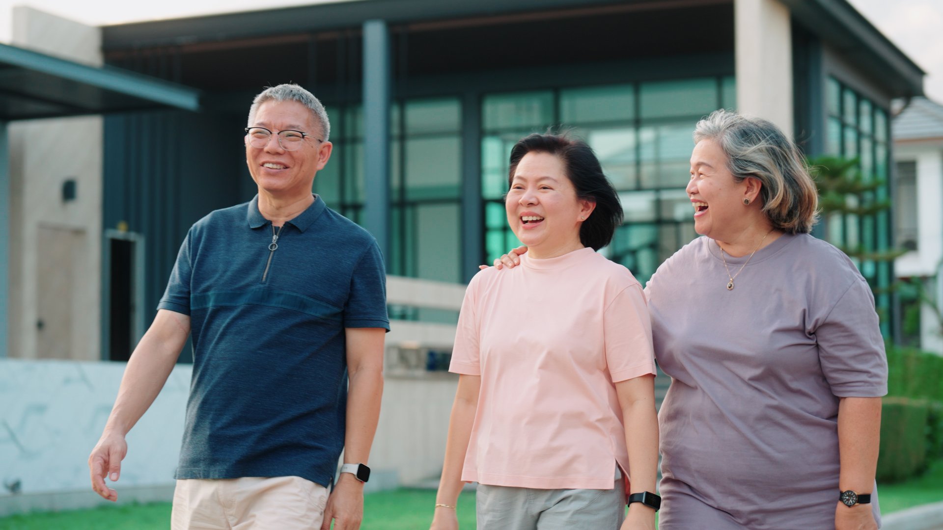 Ssmall group of seniors taking a stroll through the village in the evening.