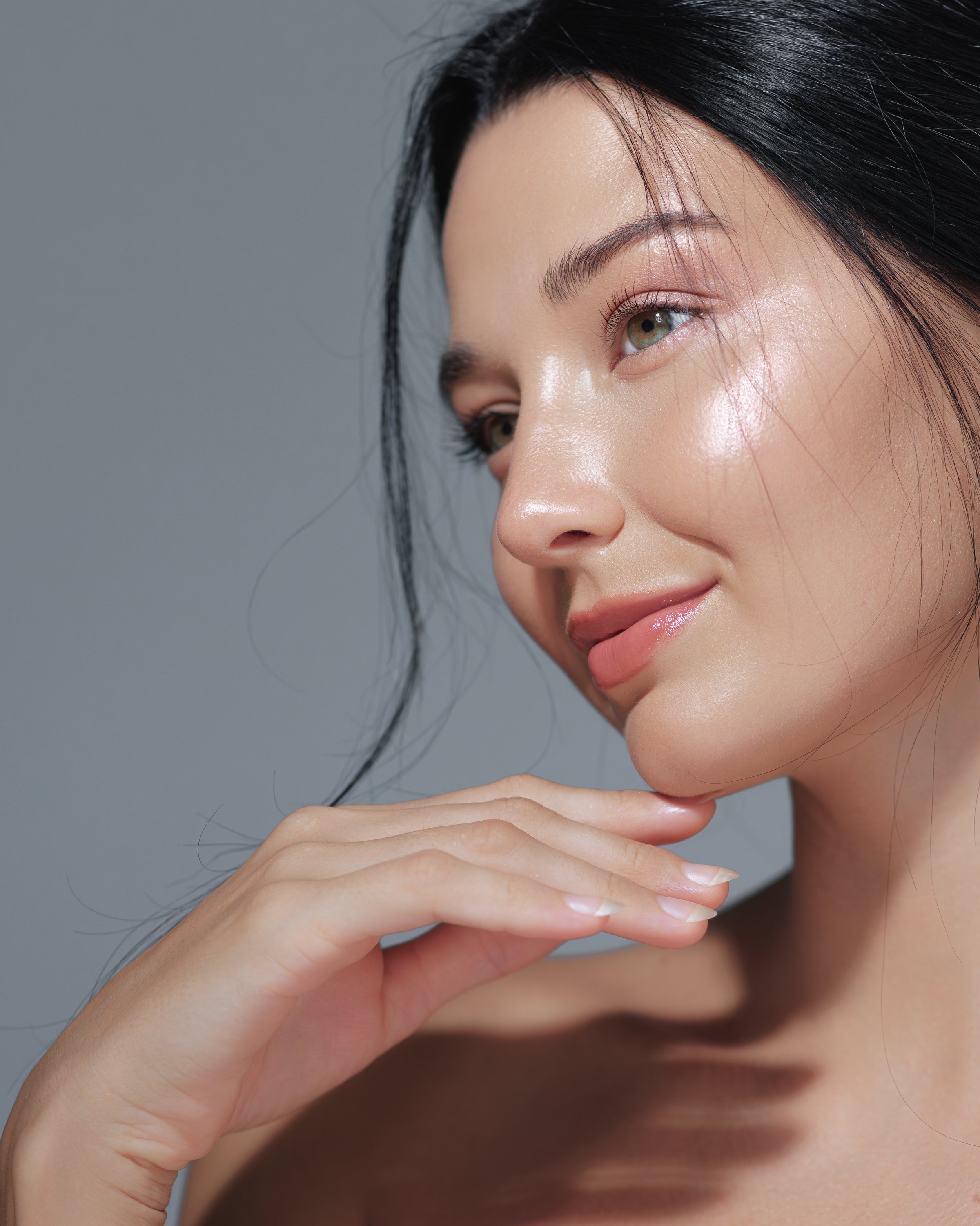 Close-up of an Asian woman with radiant skin and natural makeup, highlighting beauty and skincare. Ideal for high-quality beauty promotions, advertisements, and cosmetics concepts.