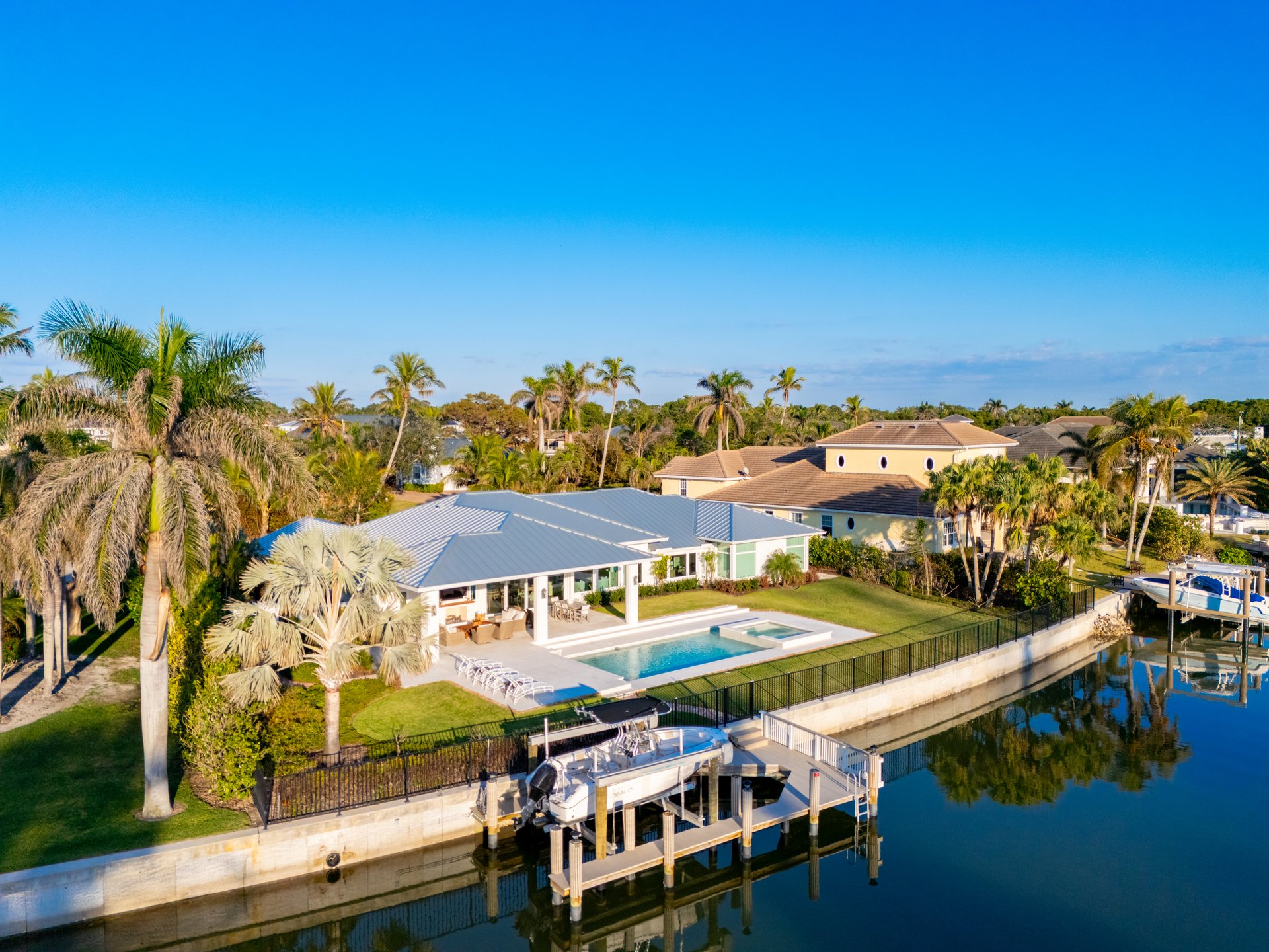 naples, FL, USA - February 6, 2025: Naples Florida aerial photo of luxury waterfront mansion homes with dock