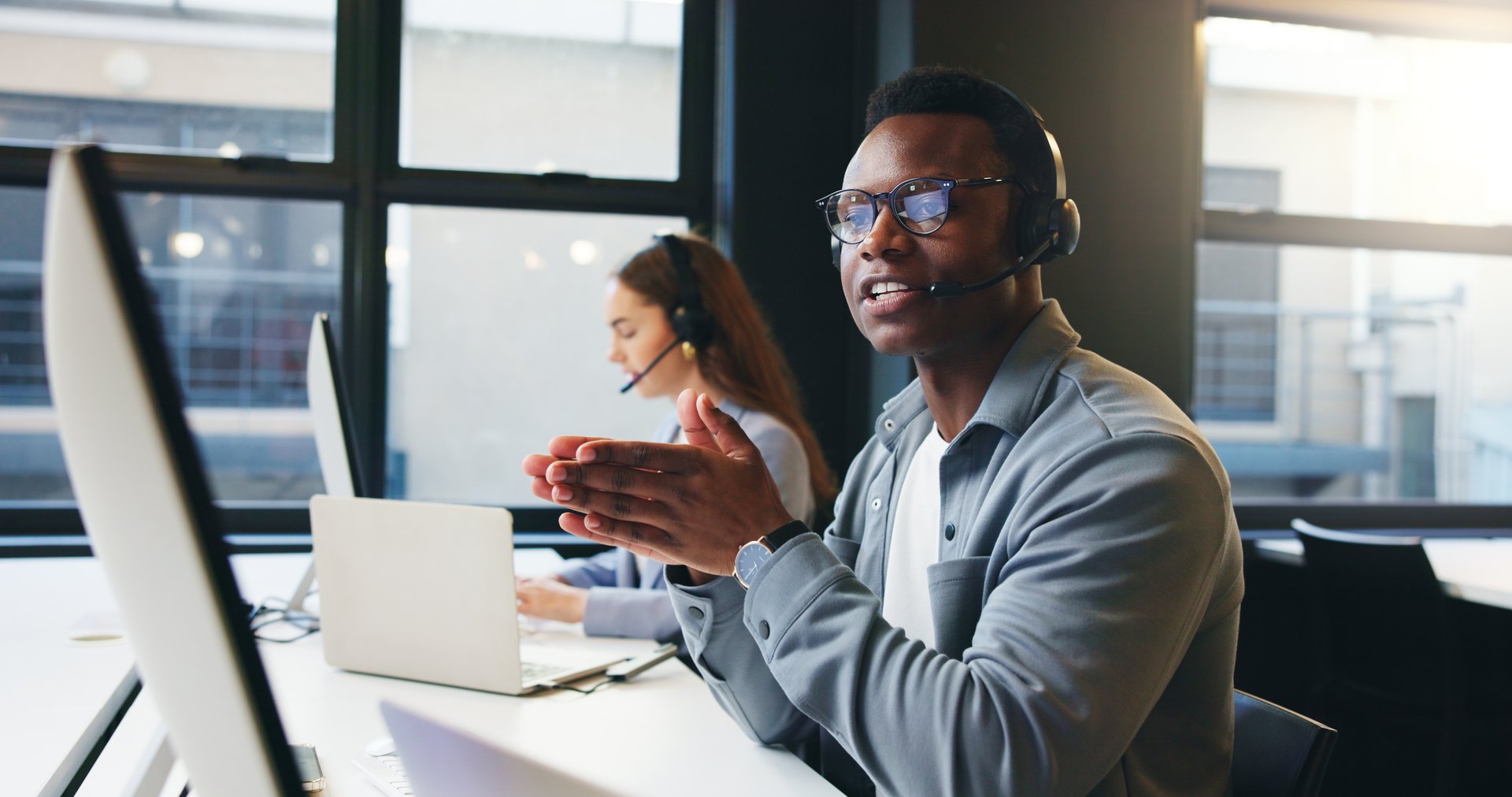 Computer, call center and man in office talking for online advice, help and customer support. Professional, coworking and business person with headset for virtual consulting, contact and crm service