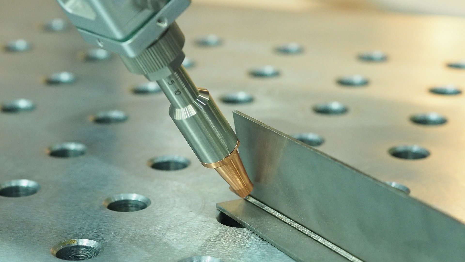 Laser welder.Close up of robot laser welding.