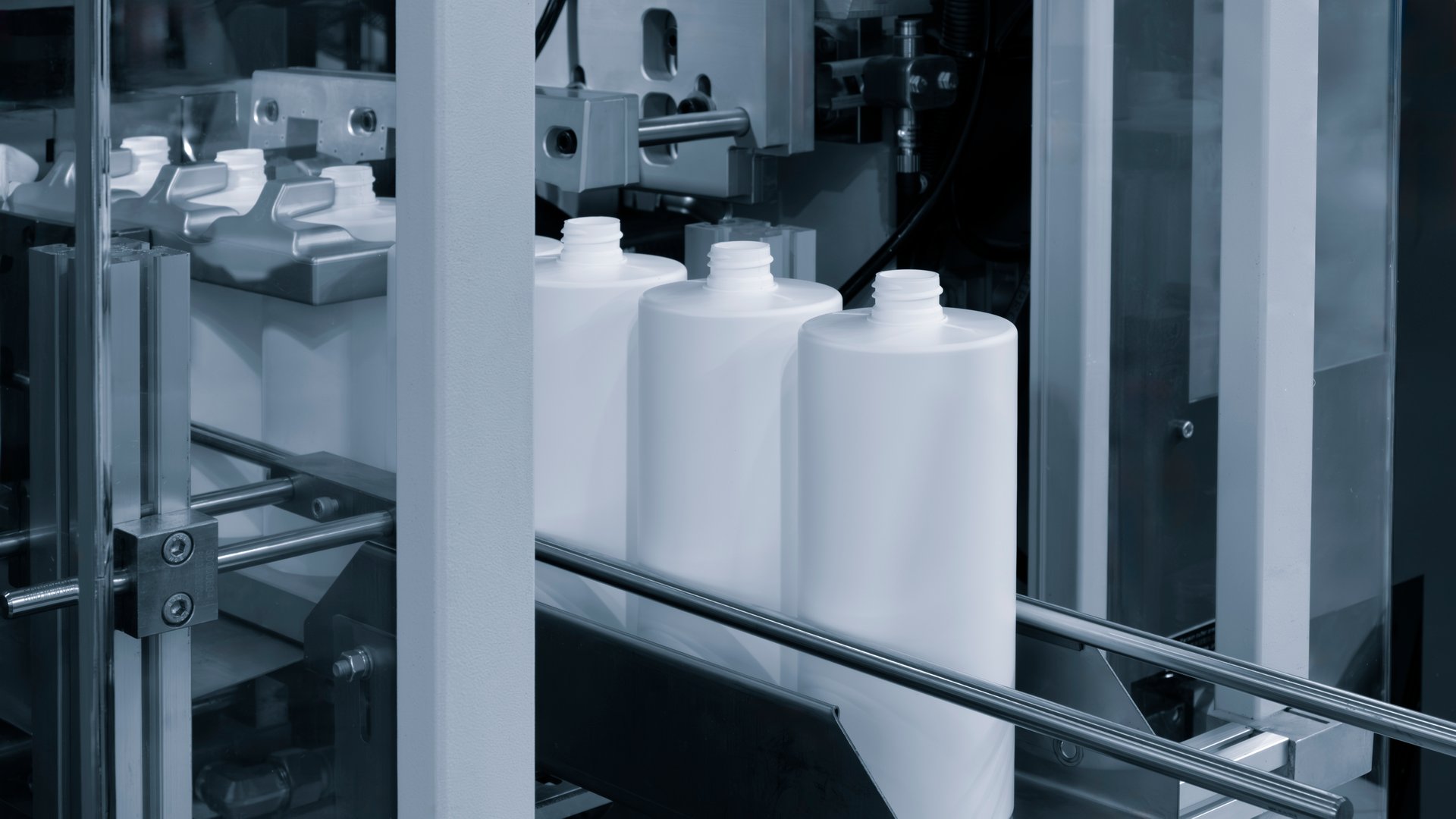 Medicine pills filling in bottle on production line